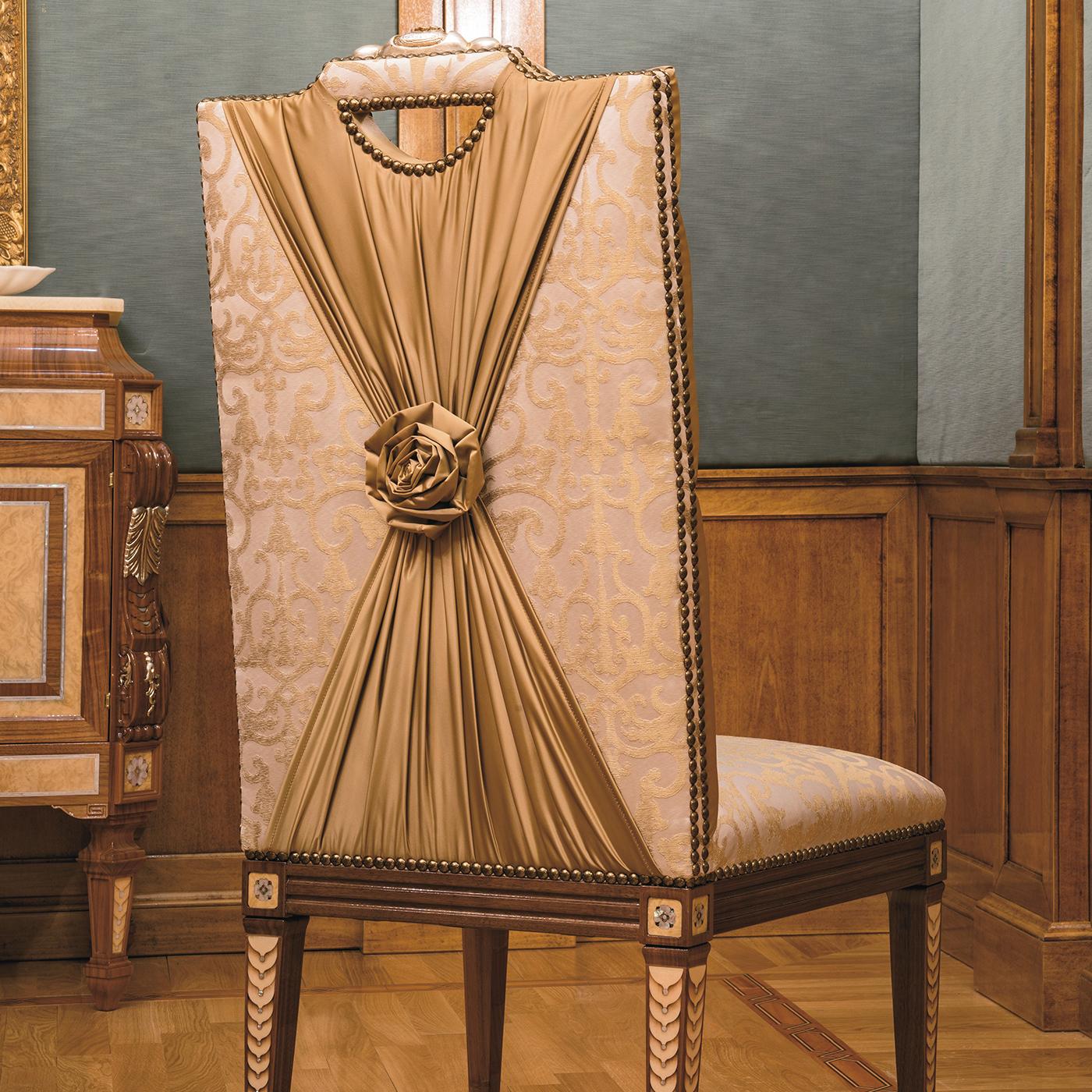 This splendid chair will create a visually alluring focal point in any classic living room, or paired with others around a luxurious dining table. Masterfully handcrafted of Canaletto walnut wood, the four legs are adorned with superb inlays in
