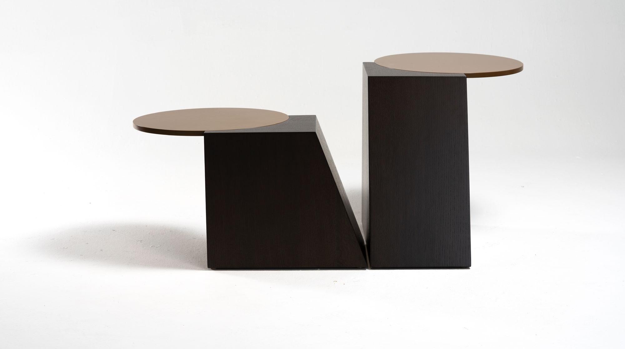 Set of 2 V tables by Jason Mizrahi
Dimensions: High W 27.5”, D 16.5”, H 18”
 Low W 24”, D 16”, H 13.5”
Materials: Base in stained oak with MDF top stained in caramel.

Available in Walnut, Oak and Ash.
Stain/Color: Customized upon