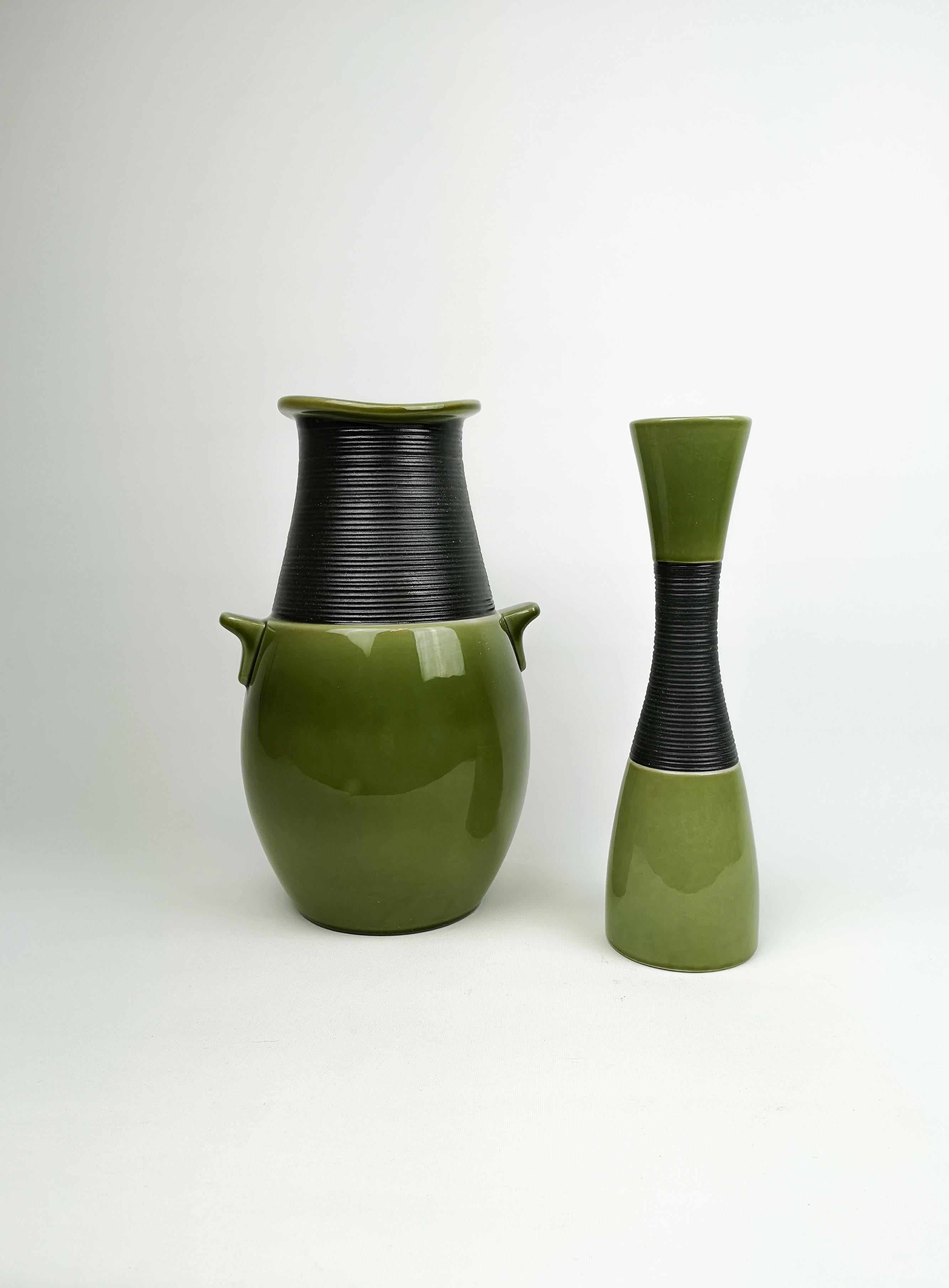 The vases were made in 1950s for Rörstrand Sweden and designed by Carl-Harry Stålhane. 

Both vases are in good condition. The small one with some age cracks on the bottom.

Measures: The Big one H 29 x 15 cm The smaller one 27 x 8 cm.
 