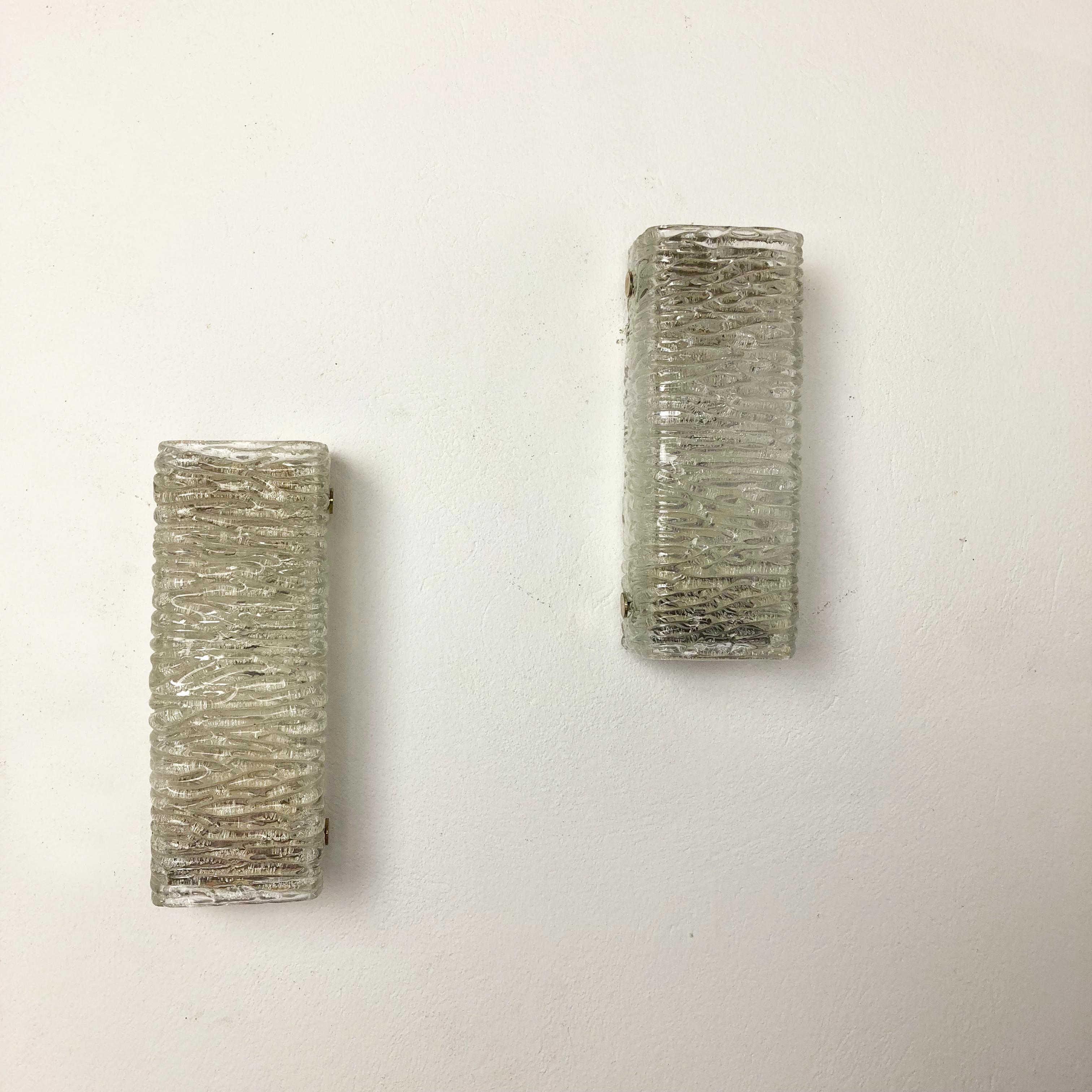 Article:

Set of two

Wall light sconces


Origin:

Germany


Producer:

Kaiser Leuchten



Age:

1960s



This set of two modernist lights was produced in Germany in the 1960s by premium German producer of the 1950 and