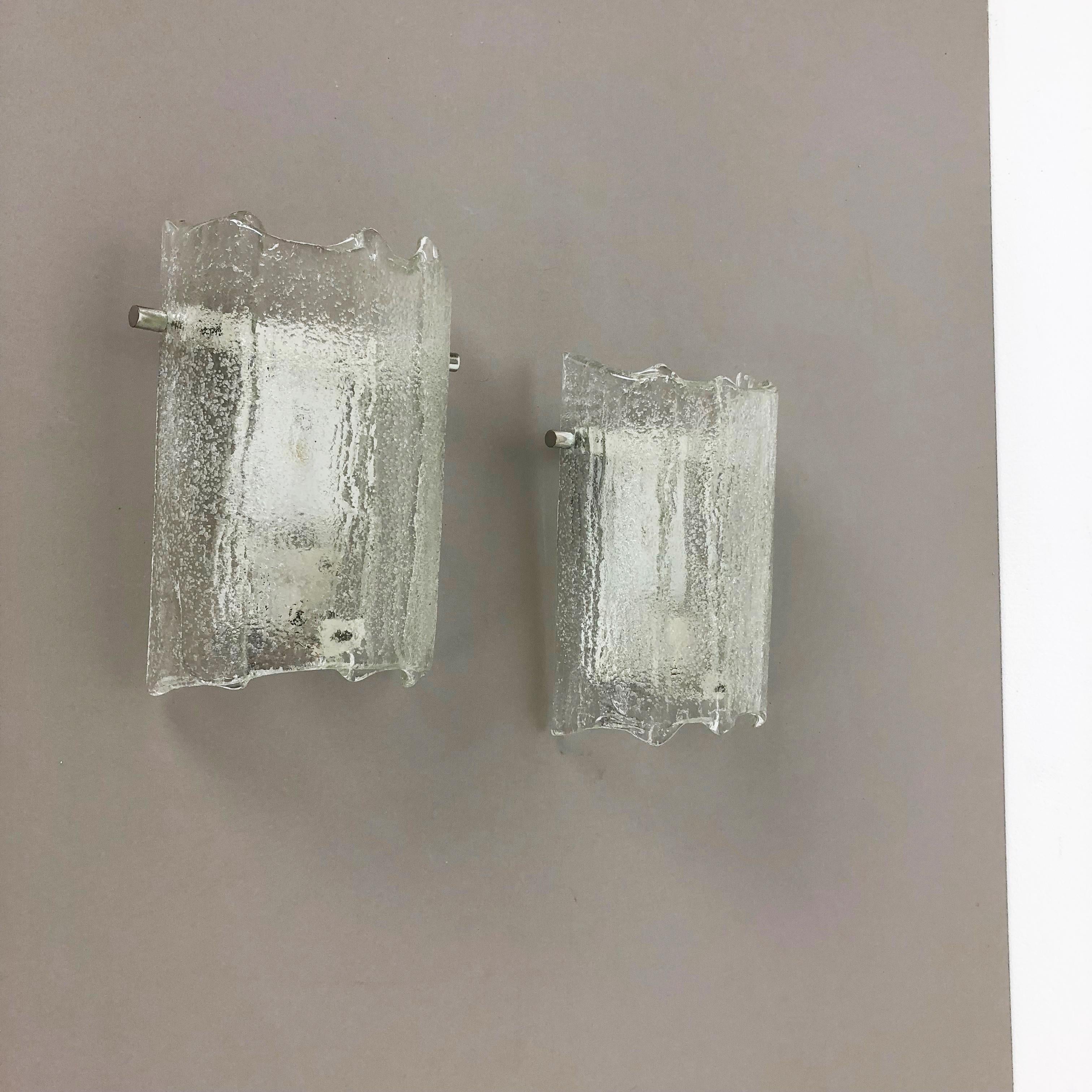 Article:

Set of two

Wall light sconces


Origin:

Germany


Producer:

Kaiser Leuchten



Age:

1960s



This set of two modernist lights was produced in Germany in the 1960s by premium German producer of the 1950 and