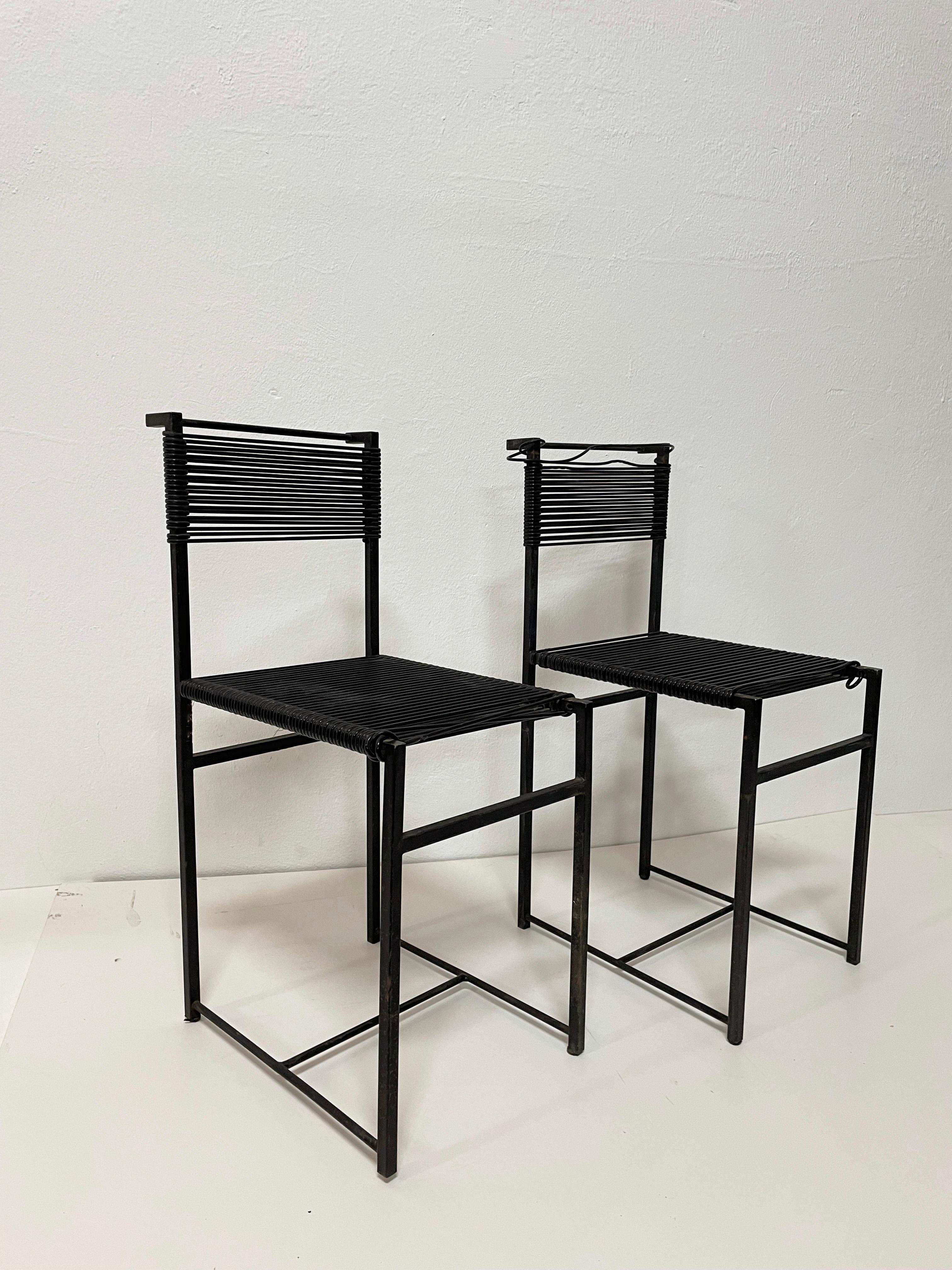 Set of 2 vintage handcrafted chairs designed in the style of Spaghetti chairs by Giandomenico Belotti

The chairs feature a minimalist black-painted steel frame and black PVC strips forming the seat and backrest.

The frame is made of rectangular