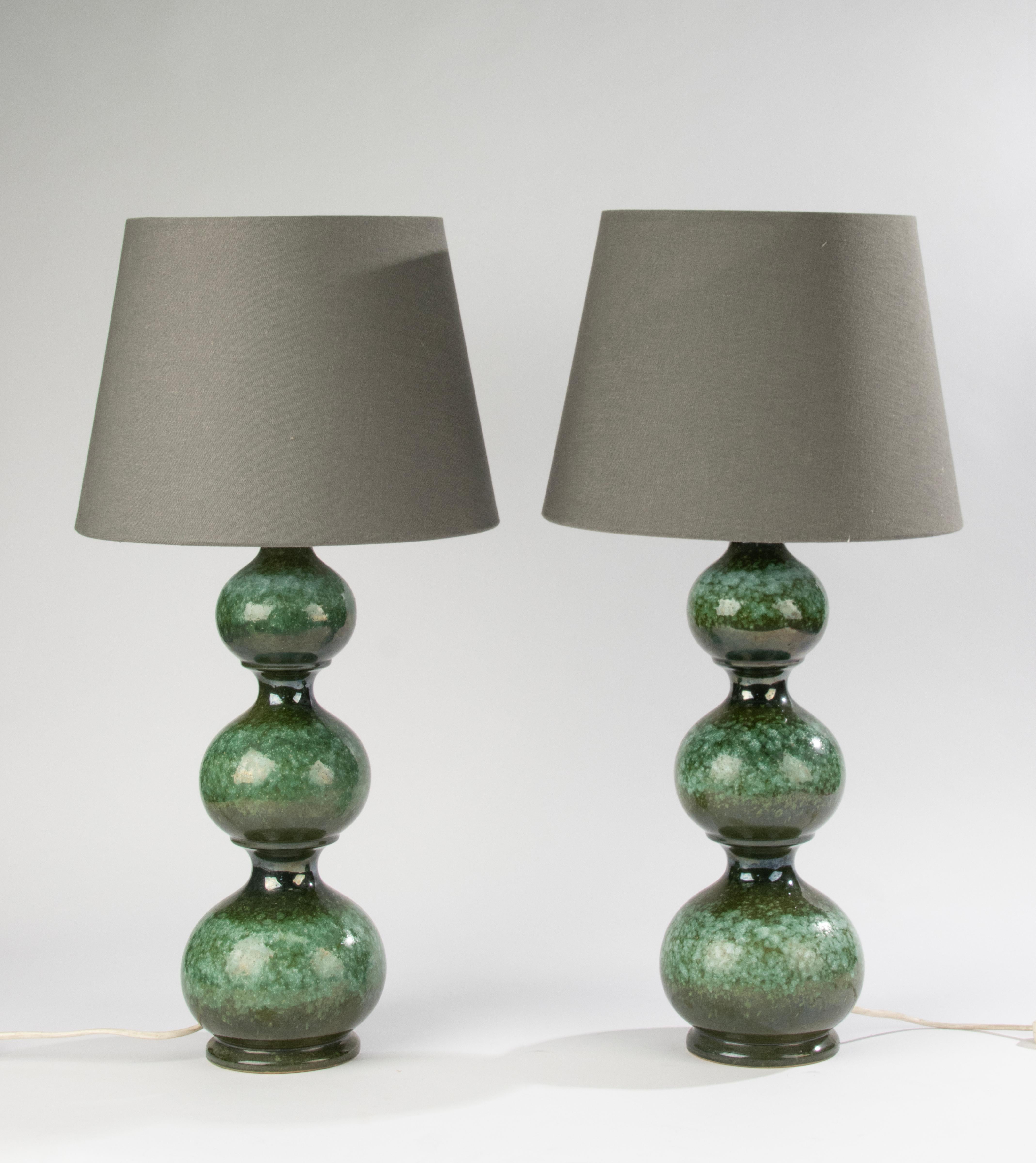 A beautiful set of 2 ceramic table lamps, made by the German brand Kaiser Leuchten.
The ceramic is beautifully made, with a subtle color gradient and beautiful crackle in the glaze.
These lamps are quite rare and you rarely come across them in a