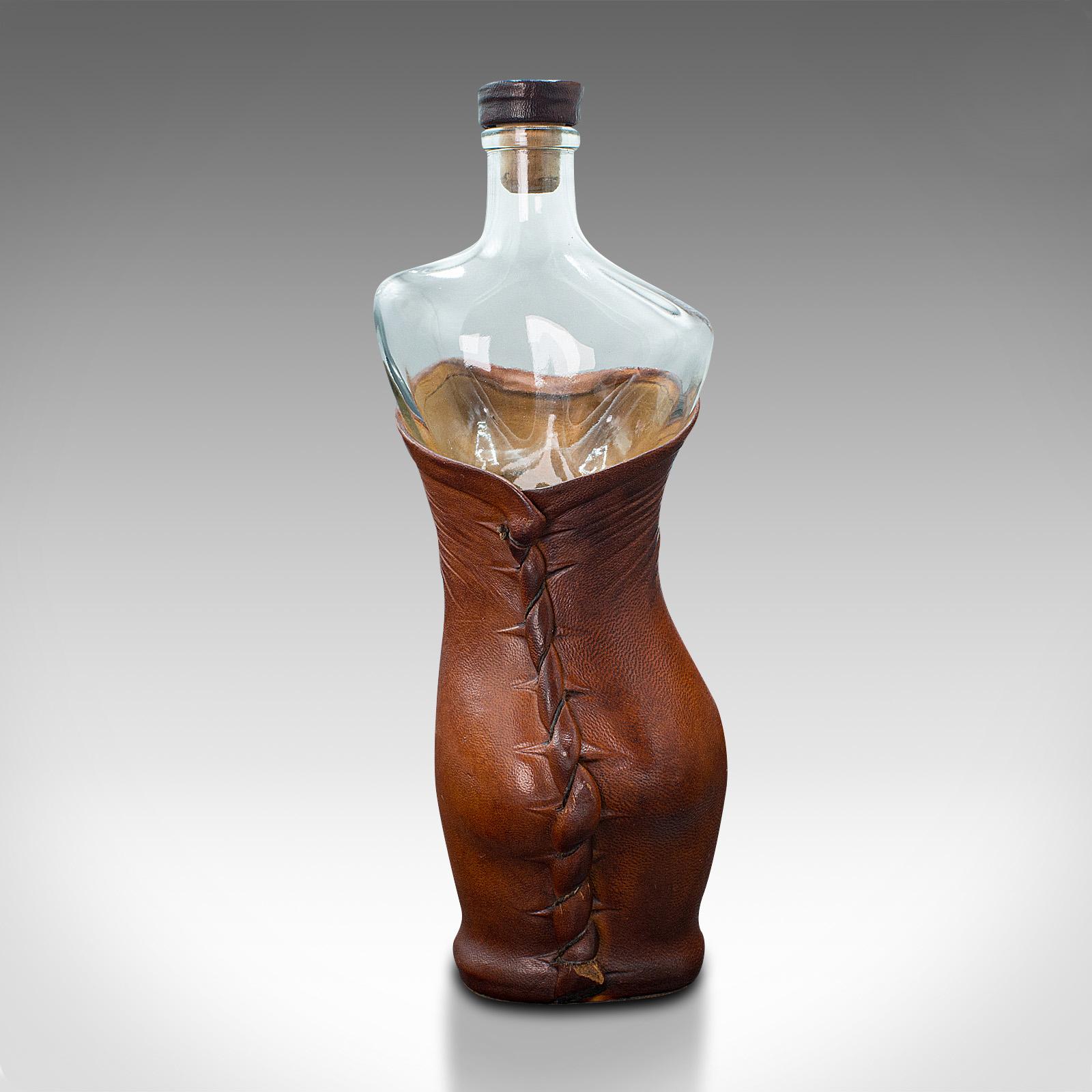 glass bottle shaped like a woman