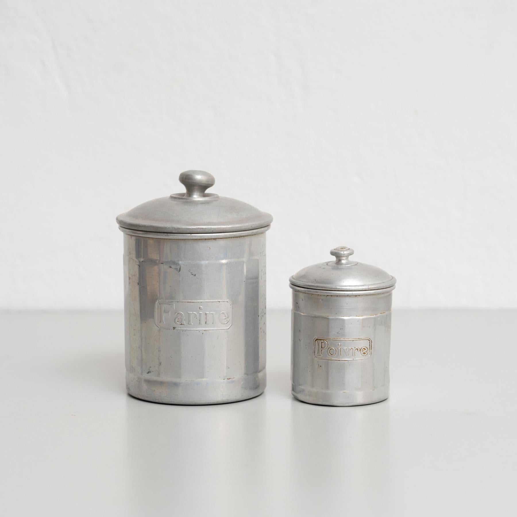 This exquisite set of metal pots, originating from France in the early 20th century, is a true collector’s treasure. Each pot is meticulously designed to store essentials like coffee, pepper, sugar, and other pantry staples. The set showcases the