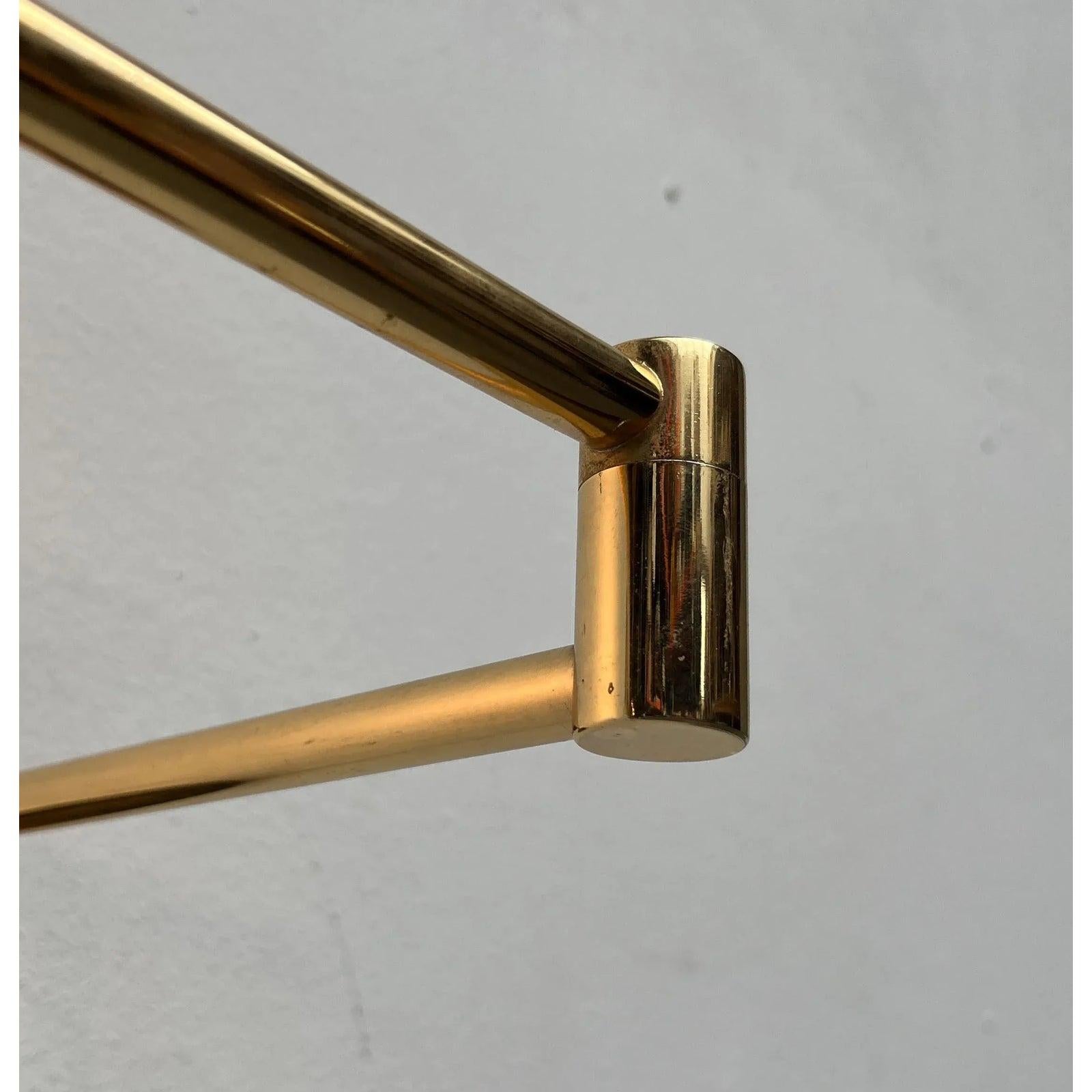 Two elegant wall lights in brass.

The design impresses with its simple elegance and high-quality materials. The strikingly shaped reflector sits at the end of a swivel arm. The arm has several joints. The range and orientation of the lights can be