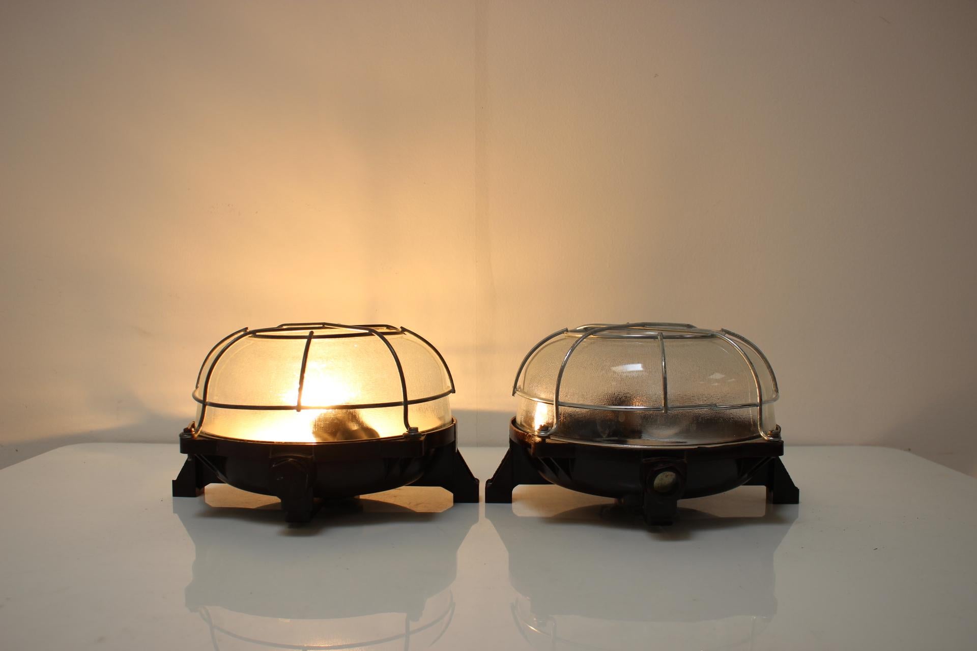 Vintage Industrial Ceiling Lamp, made in Czechoslovakia, in the 1960's.
Made of bakelite, metal and glass.
Repolished, cleaned, shows signs of use.
Fully functional.