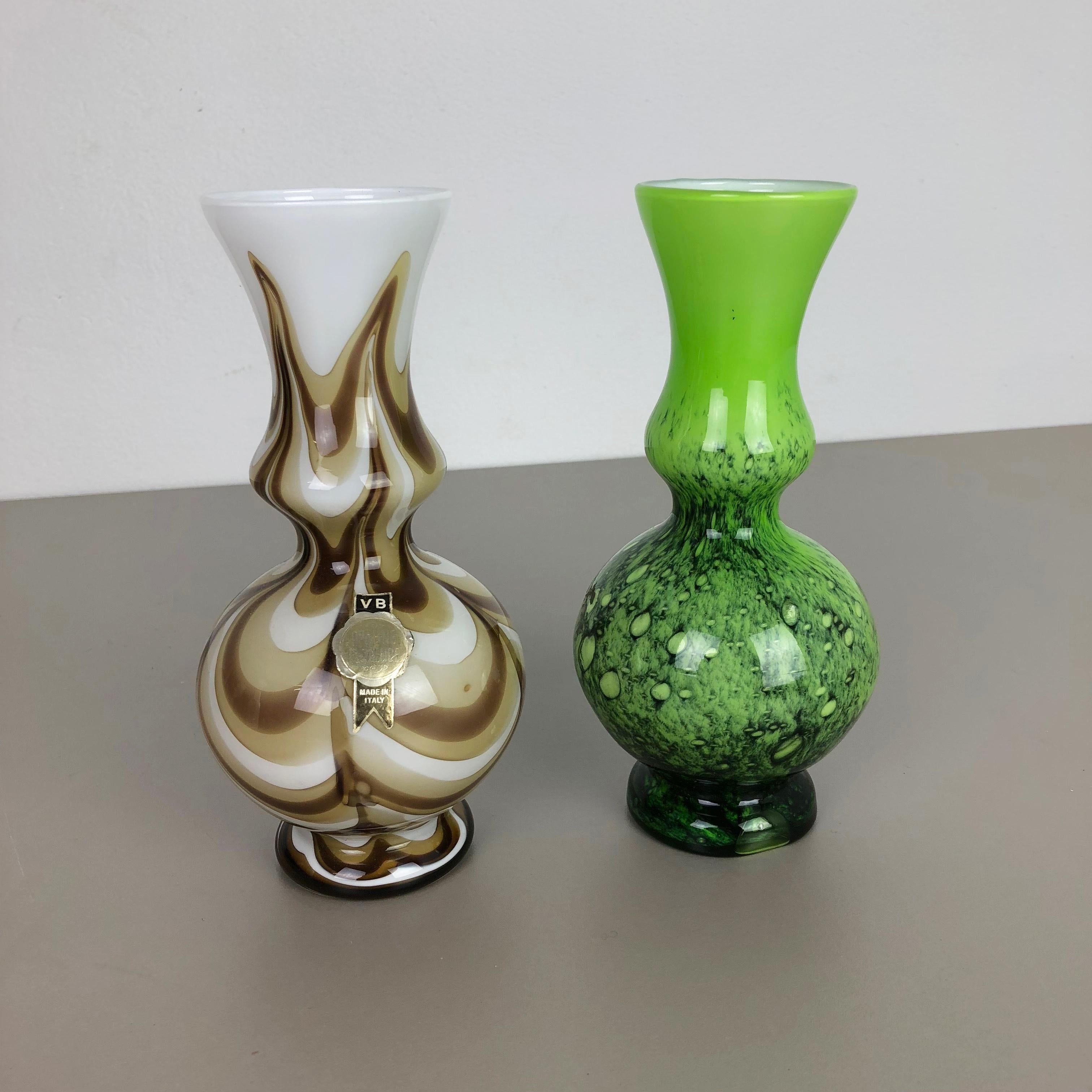 Article: Pop art vase set of 2

Producer: Opaline Florence

Design: Carlo Moretti

Decade: 1970s

Description: Original vintage 1970s Pop Art hand blown vase set made in Italy by Opaline Florence. Made of high quality Italian opal glass. The