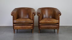 Set of 2 vintage sheep leather club chairs with a beautiful worn look