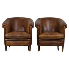 Set of 2 vintage sheep leather club chairs with a beautiful worn look