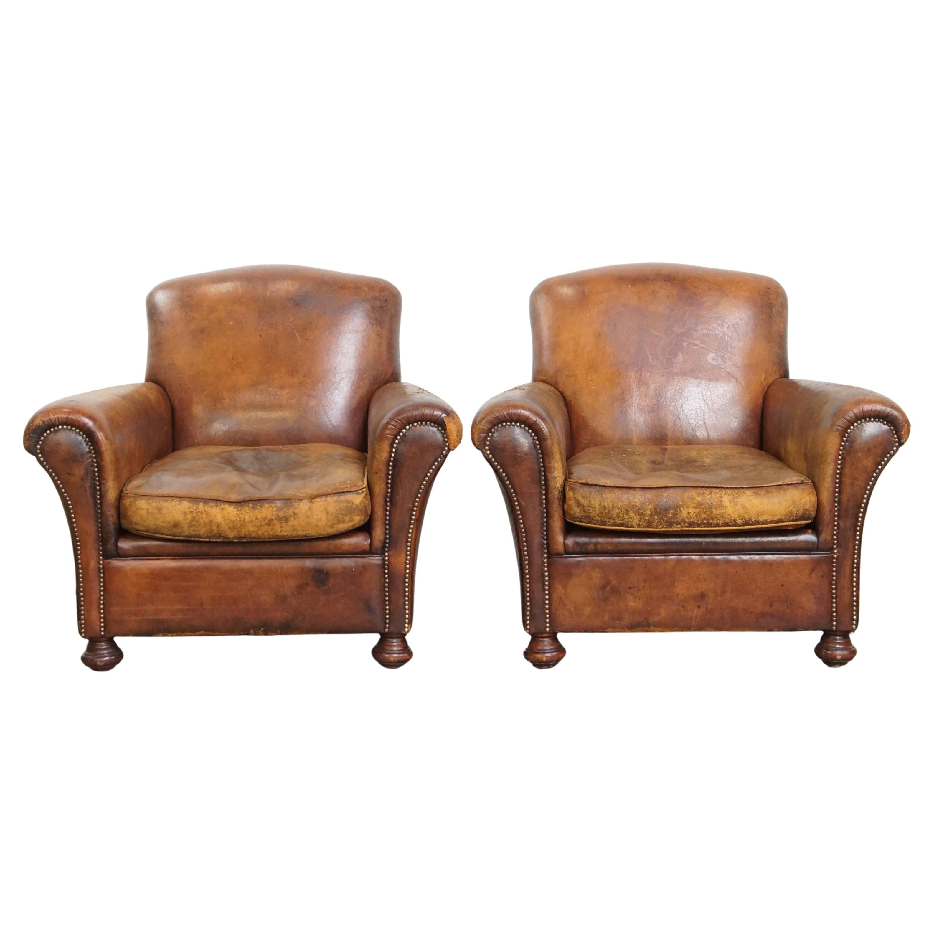 Ensemble de 2 fauteuils en peau de mouton vintage