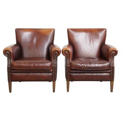 Set of 2 vintage sheepskin leather armchairs