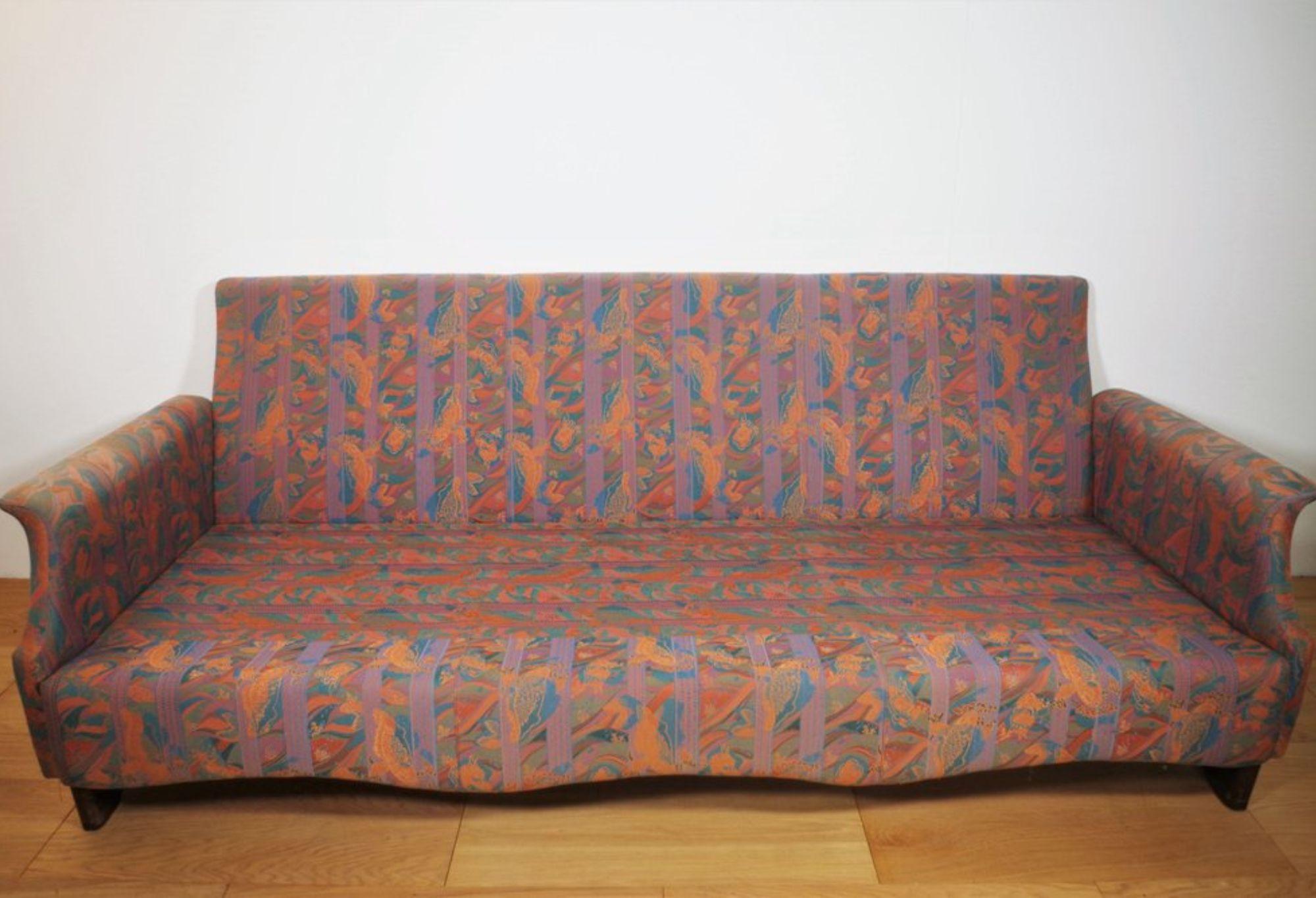 Set of 2 Vintage Sofas, 1970s
A set of two vintage sofas from the 1970s, featuring a bold, multicolored fabric upholstery with an abstract pattern typical of the era. The soft curves and well-padded cushions ensure both comfort and style, making