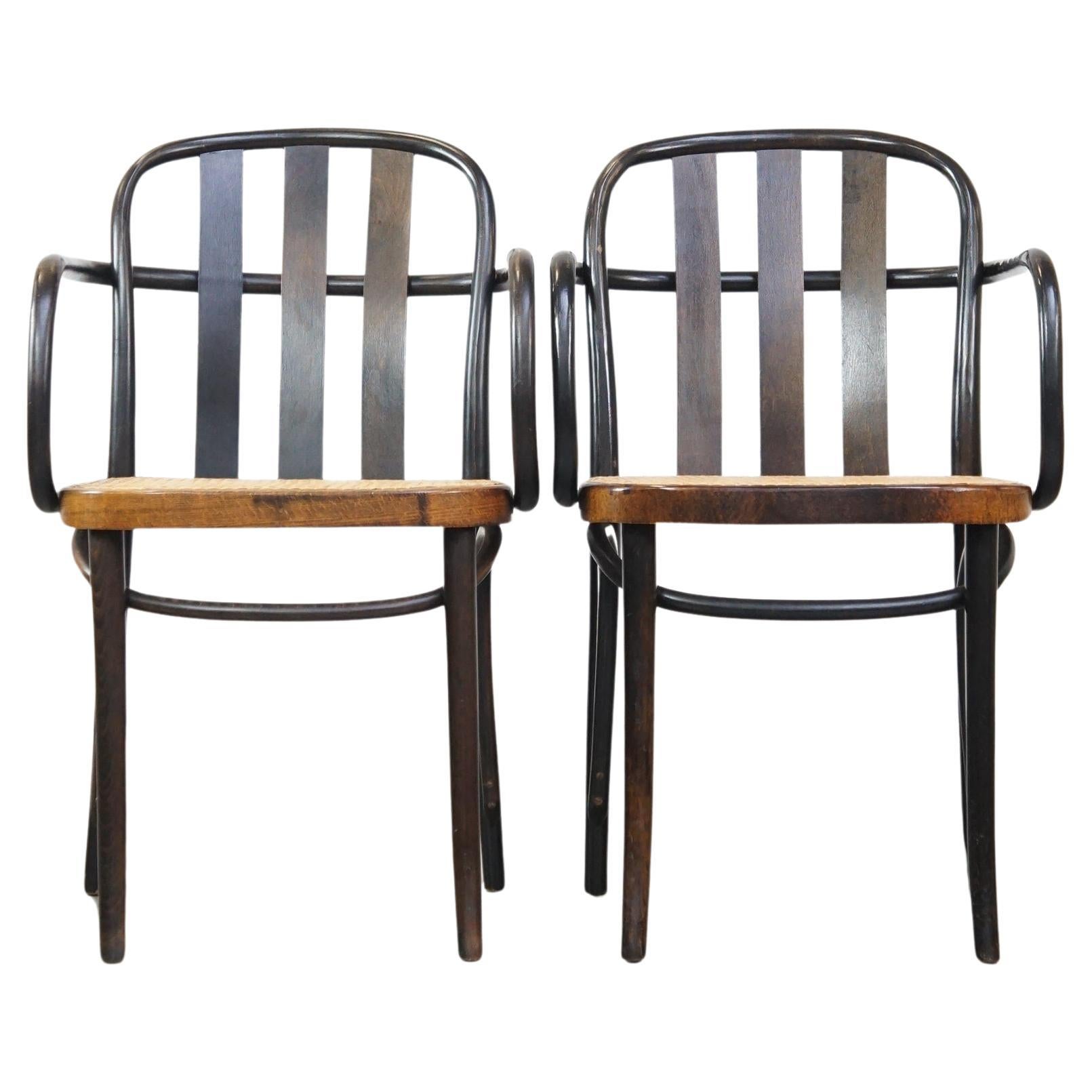 Set of 2 vintage wooden design dining/bistro chairs with woven seats