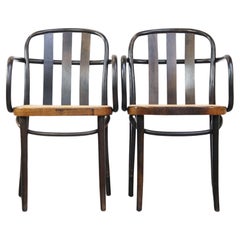 Set of 2 vintage wooden design dining/bistro chairs with woven seats