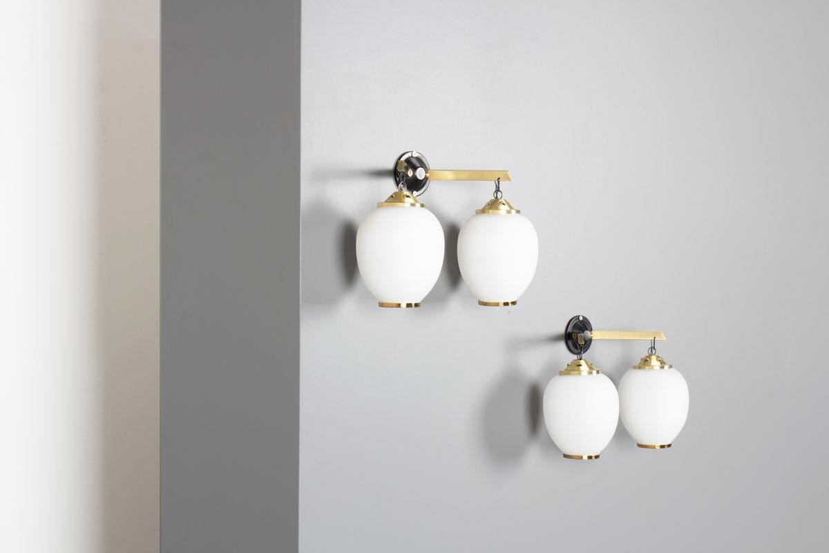 Set of 2 wall lights from the 50s, made in Italy
Lantern model
Black lacquered metal structure, brass arms, opaline glass globes
Design chic and elegant