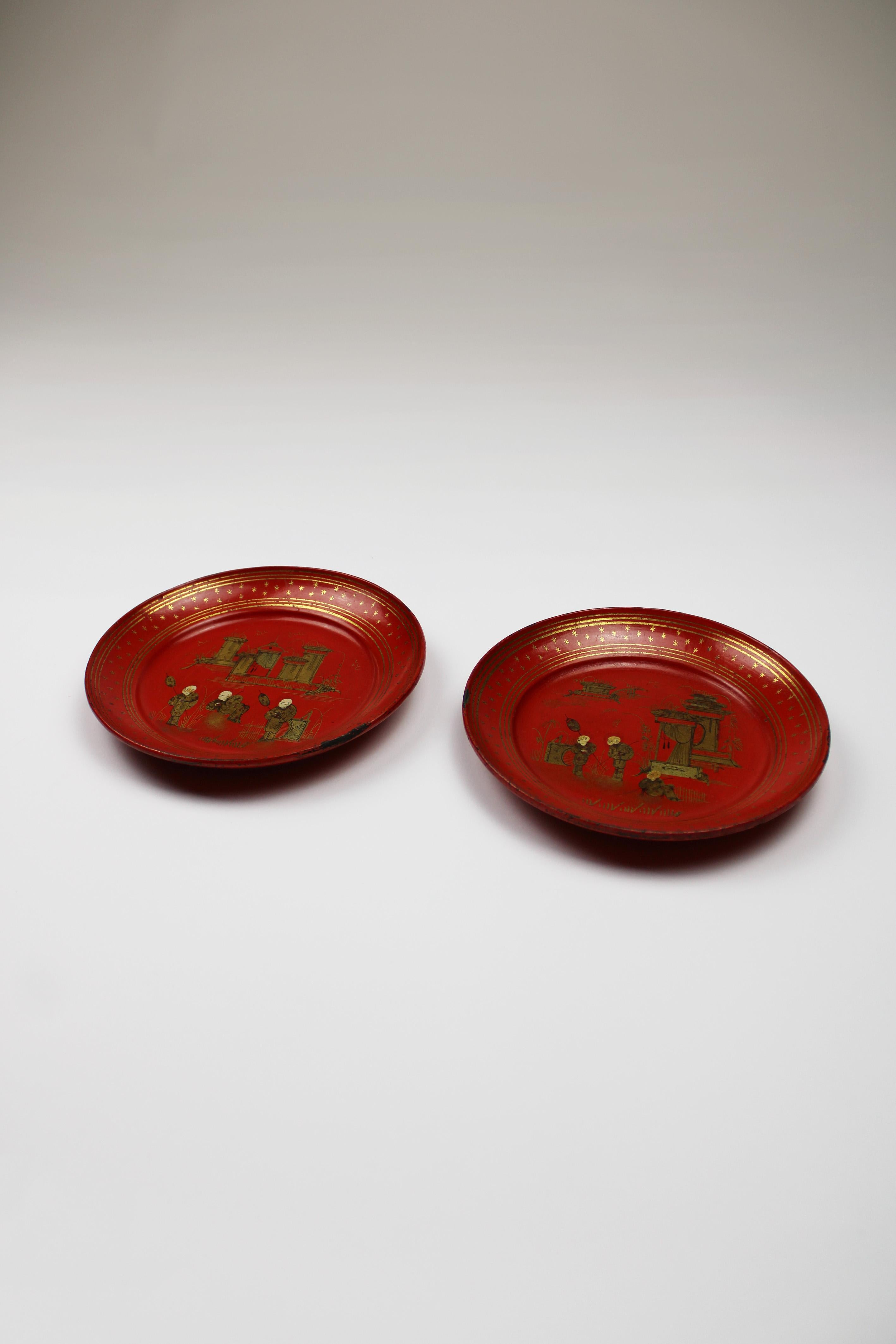 These two bottle coasters instantly catch the eye with their vibrant red hue and intricate gold Chinese designs. Dating back to the era of Napoleon III, the last emperor of France, these coasters showcase a fusion of exotic Oriental aesthetics that