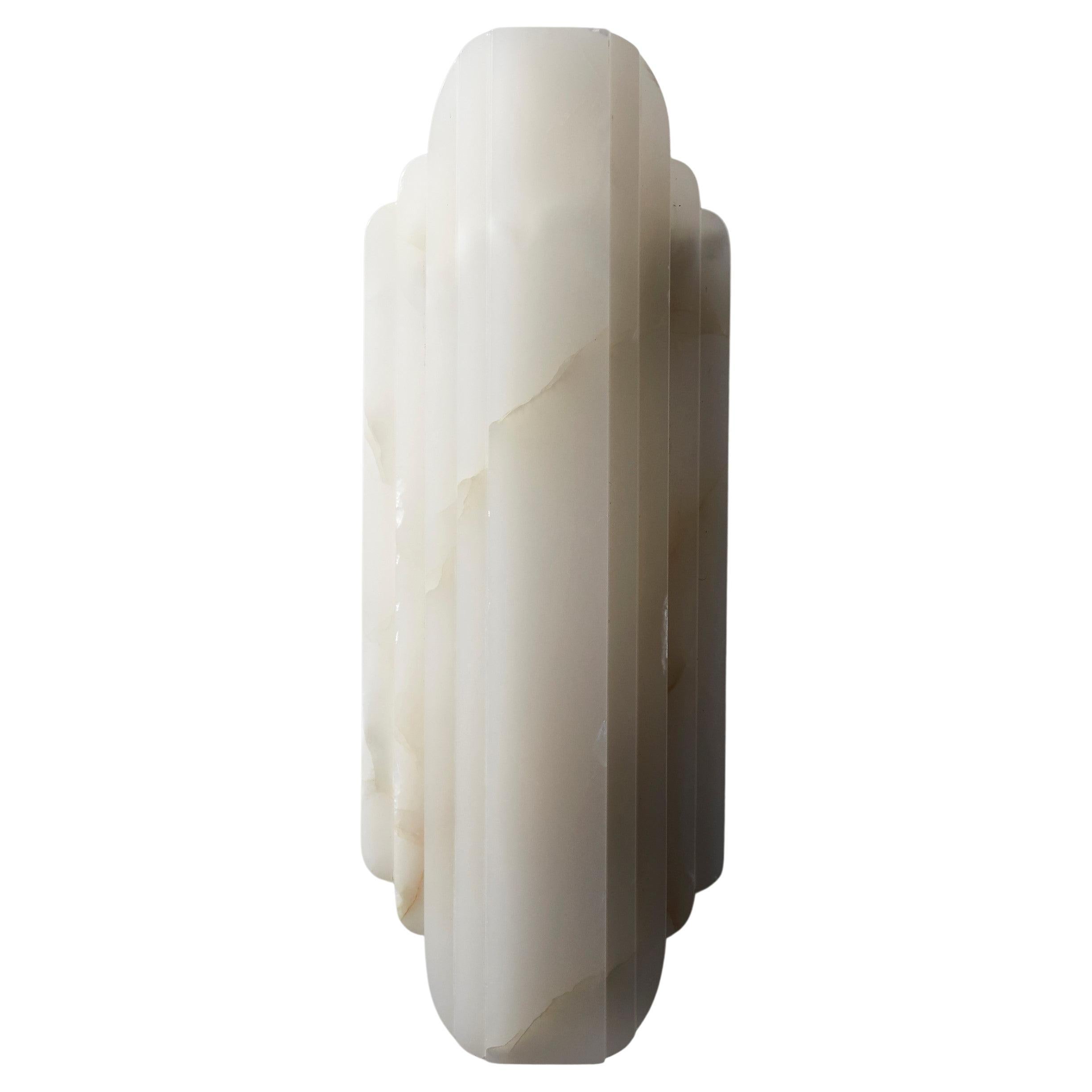Walljewel white Onyx by Lisette Rützou
Dimensions: 15 x H 42 cm
Materials: Rose, green and white Onyx

 Lisette Rützou’s design is motivated by an urge to articulate a story. Inspired by the beauty of materials, form and architecture, each