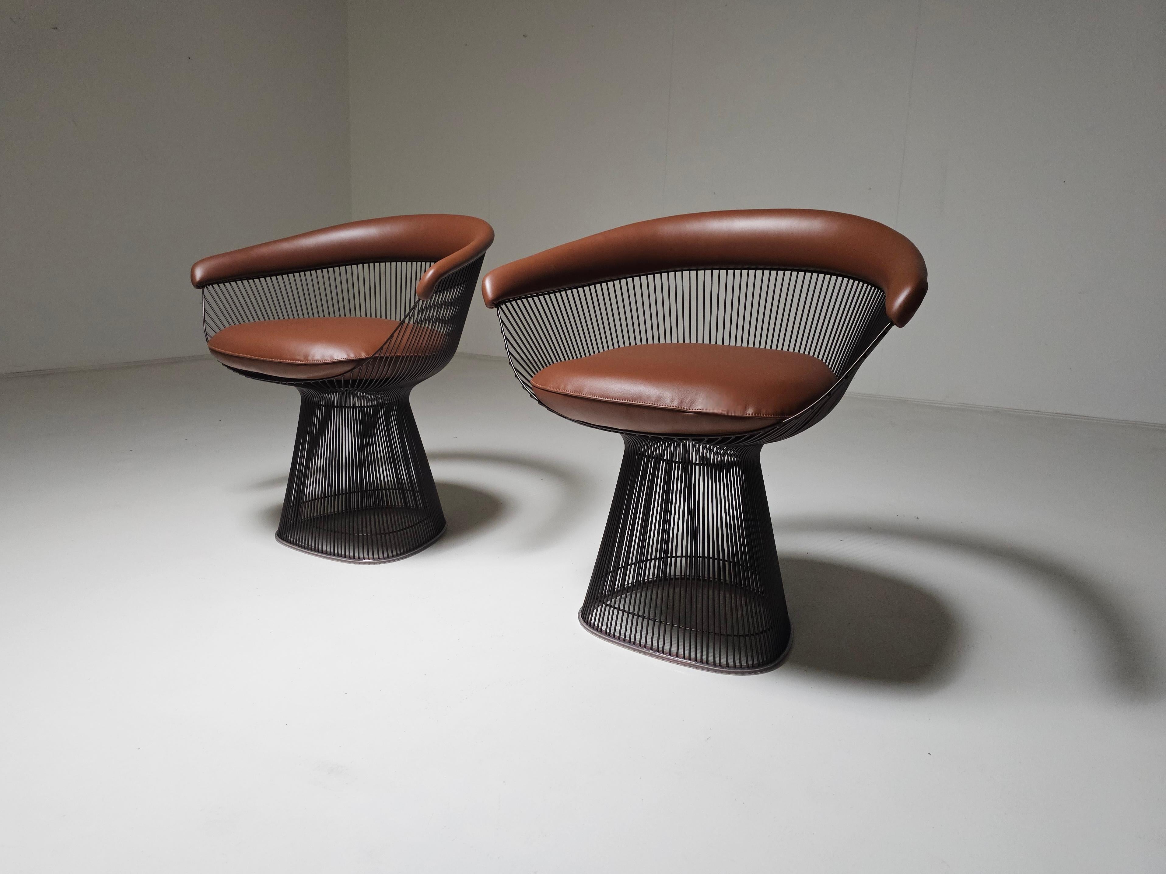 Warren Platner chairs, bronze frame, brown leather, set of 2,  Knoll International

In 1966, the Platner Collection captured the “decorative, gentle, graceful' shapes that were beginning to infiltrate the modern vocabulary. The armchair, which can