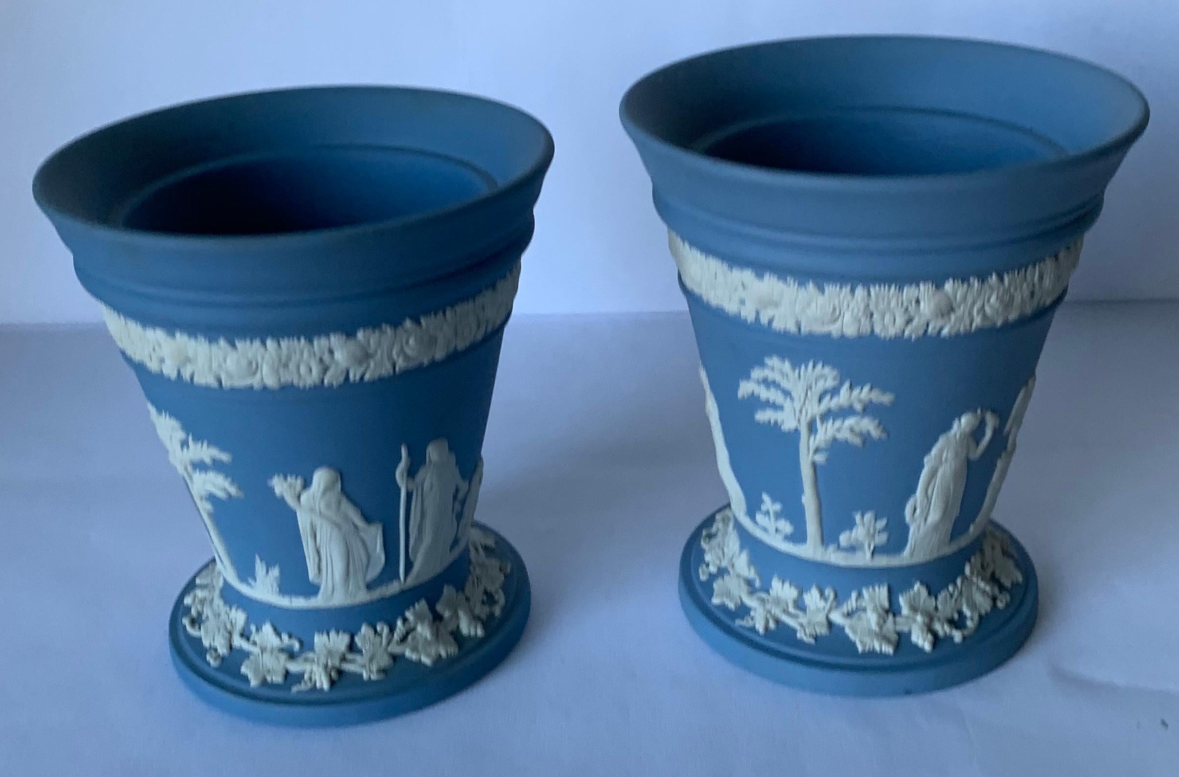 Set of two Wedgwood light blue flower vases. Overall neoclassical motif. Stamped on the underside. Each vase varies slightly.