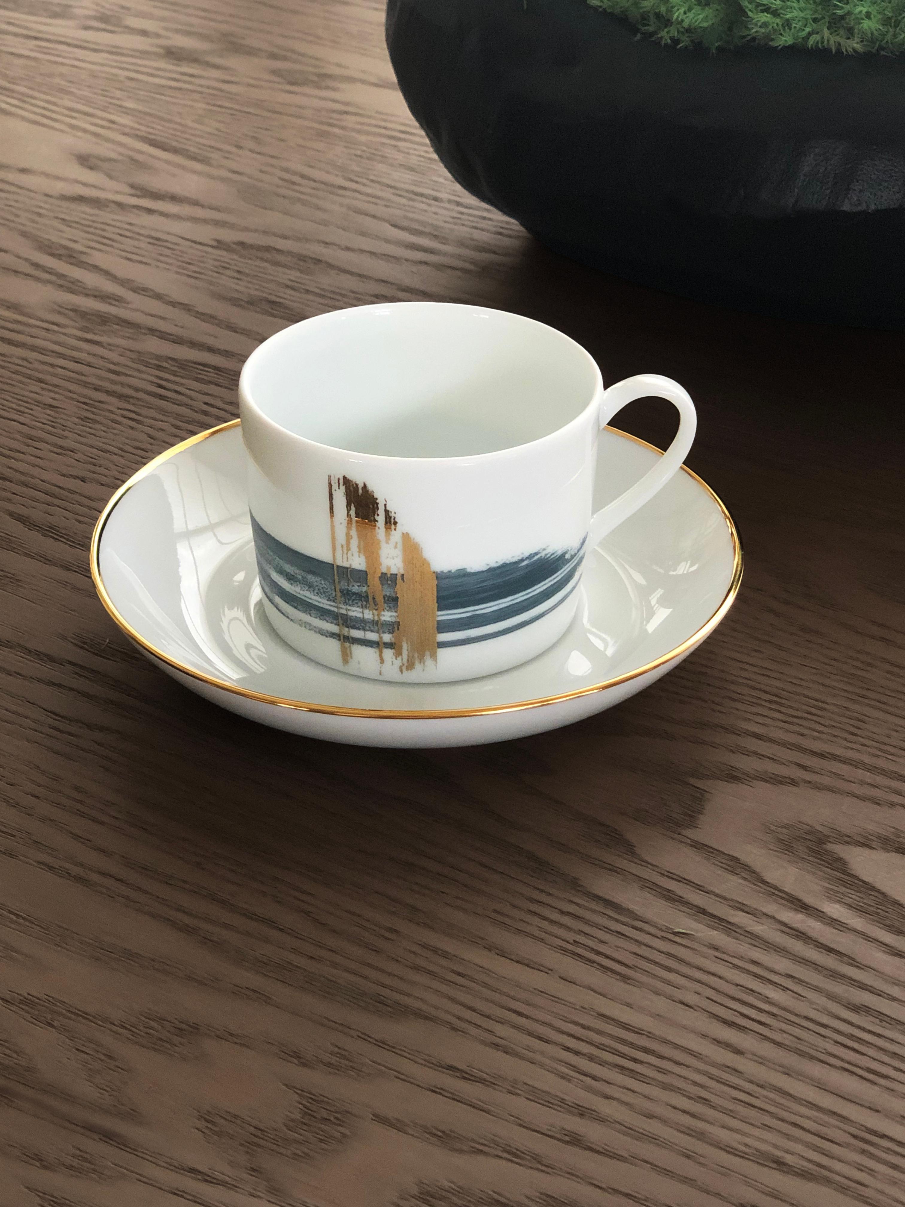 Larger quantities available upon request, with 8 weeks production time.

Description: Western tea cup with saucer (2 pieces)
Color: Blue and gold
Size: 7.5Ø x 5.5H cm, 170 ml
Material: Porcelain and gold
Collection: Artisan Brush