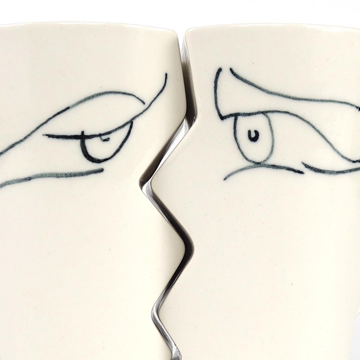 Niek Zwartjes and Zorka Bezpalcovà are the driving forces behind Amsterdam based Studio Zwartjes. 
These good looking mugs have such a shape that, when very near to each other, they almost automatically strike a kissing pose.
Apart from each other
