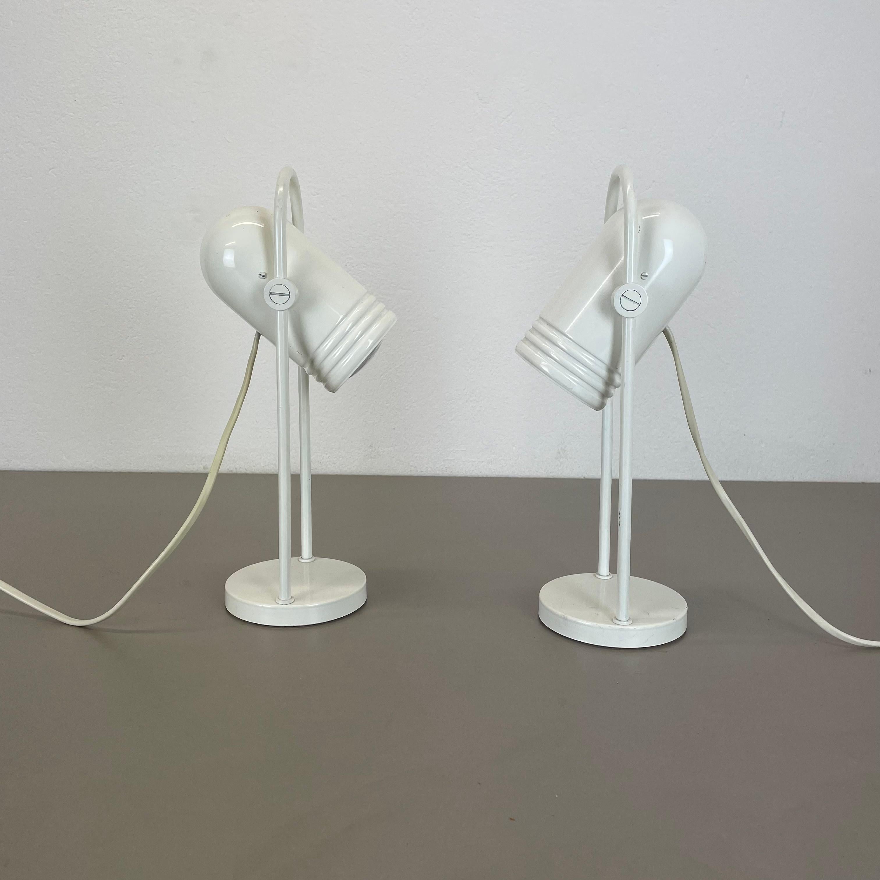ARTICLE:

set of 2 table lights


AGE:

1970s


DESCRIPTION:

set of 2 original 70s german modernist table Lights made of solid metal with an adjustable spot shade on the top. this light was designed by Rolf Krüger for Heinz Neuhaus
