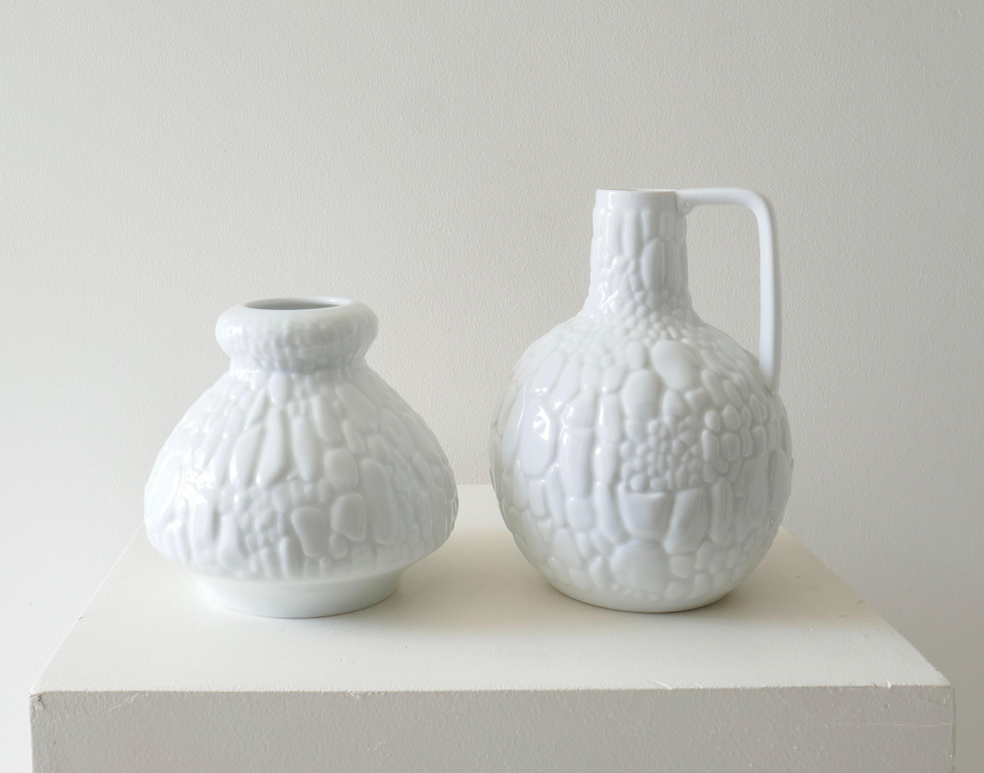 Set of 2 white porcelain vases by Kaiser, Germany, 1970s 
From left H14xD15cm, H20xD15cm.