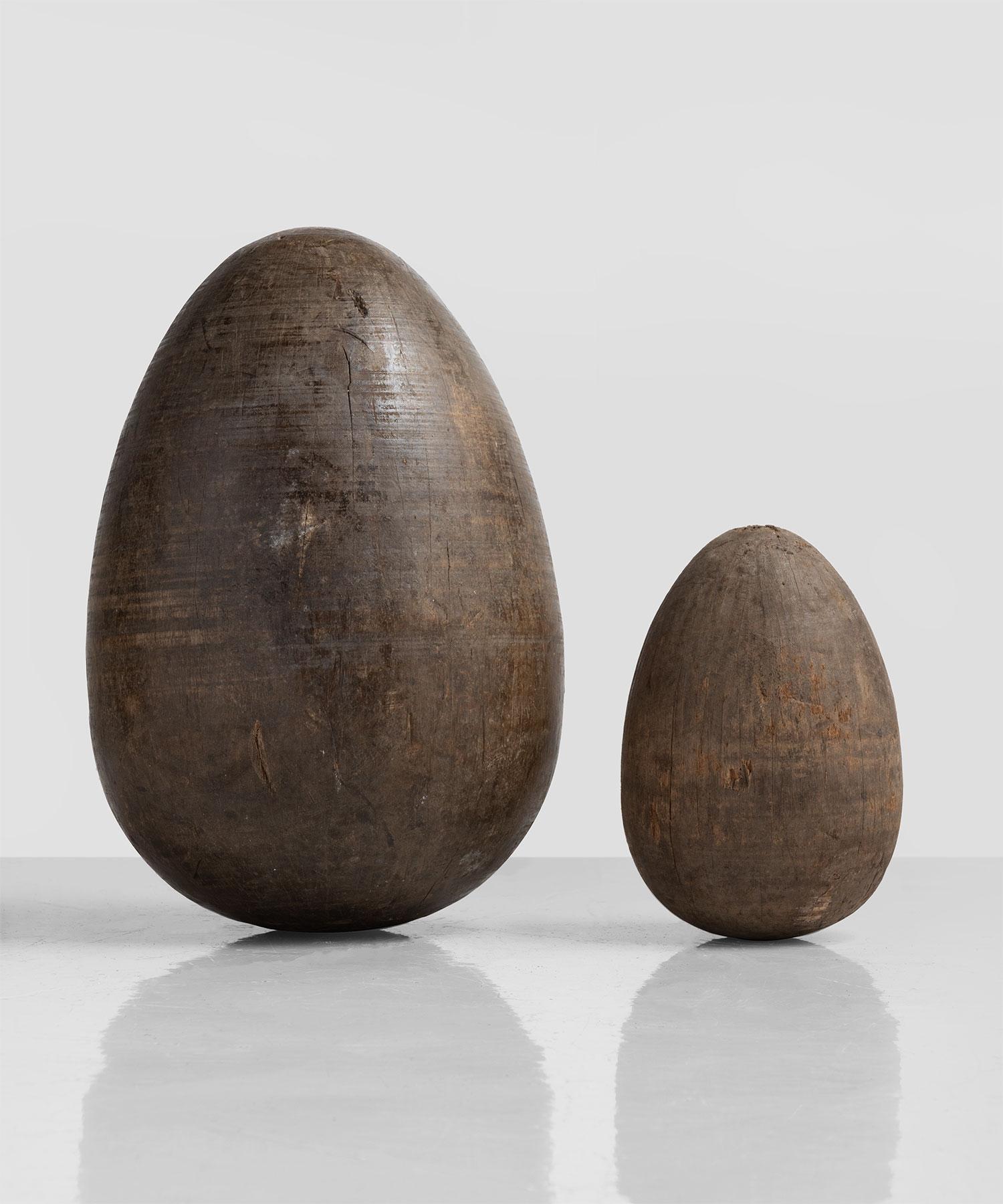 Set of two Wooden Egg Moulds, England, circa 1890.

Heavily patinated forms originally used to make papier mache forms.

Measures: 11.5