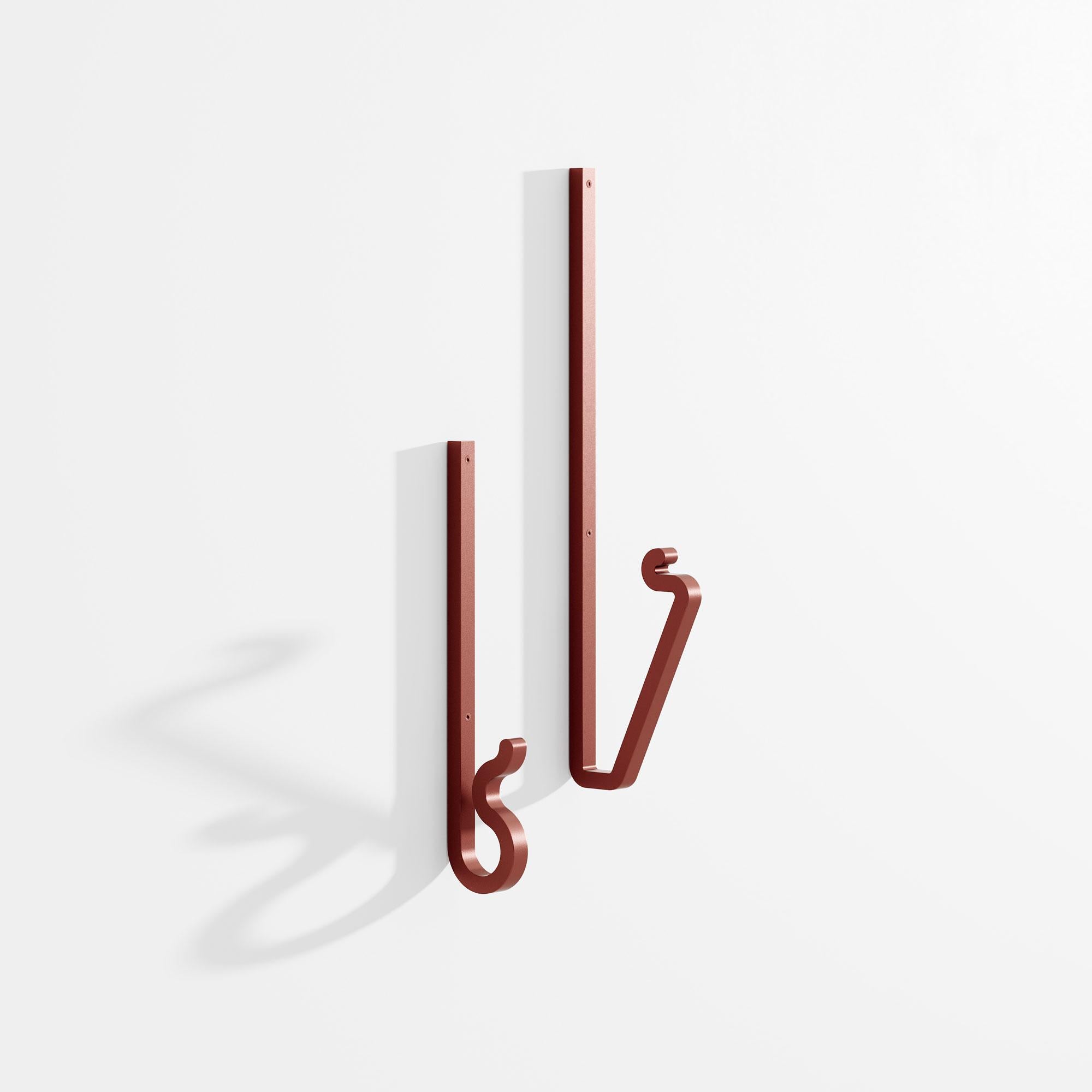 Set of 2 Zag coat hanger by Bling Desing Studio
Dimensions: H 25,5 x L5 - H 36,5 x L9
Materials: old red textured metal


Zag is a family of coat hooks whose shapes are inspired by barrettes and pins. Each Zag is like an imaginary letter that