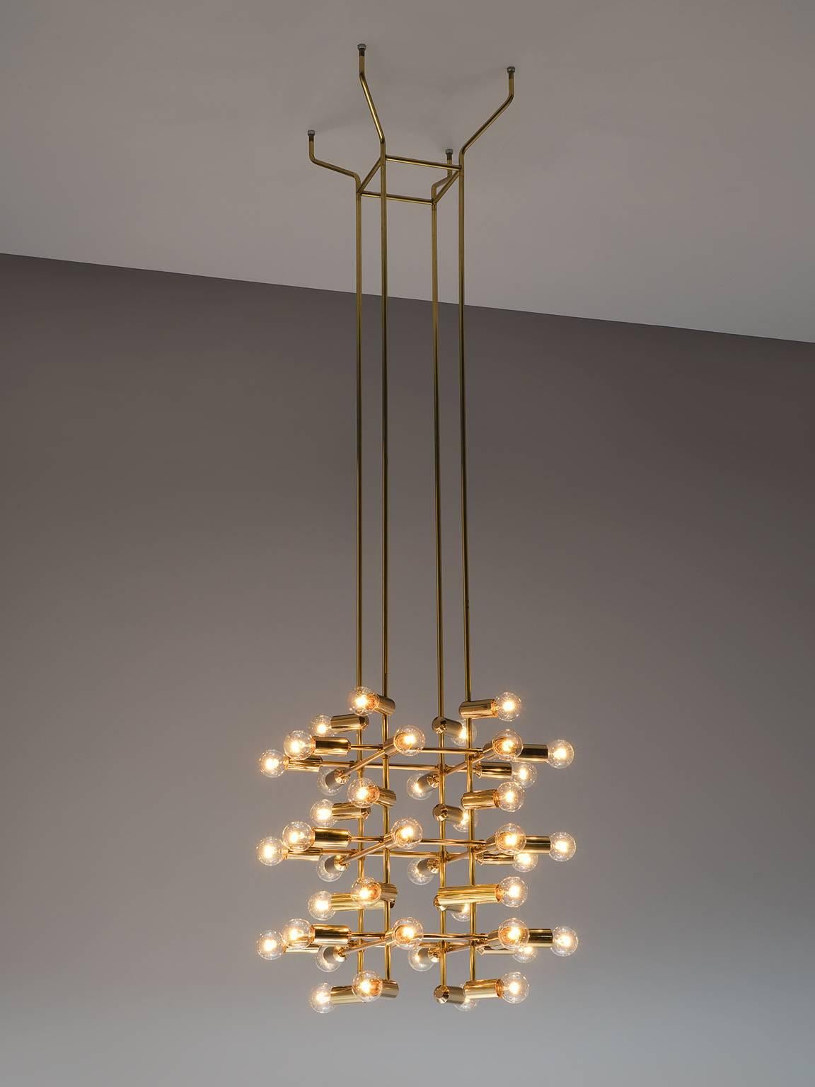 Set of 20 chandeliers in brass, Switzerland, 1960s.

This set of 20 delicate chandeliers are Minimalist yet warm. Each light consists of 40 light bulbs that are placed on the ends of brass horizontal beam. The beams form a cross-like pattern that is