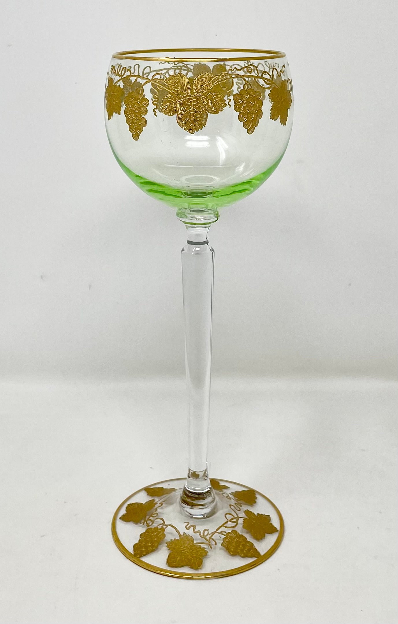 Set of 20 Estate German green crystal wine glasses with gold leaf details, circa 1940-1950.
Every one in superb condition with heavy gold-leaf details in a grape motif.