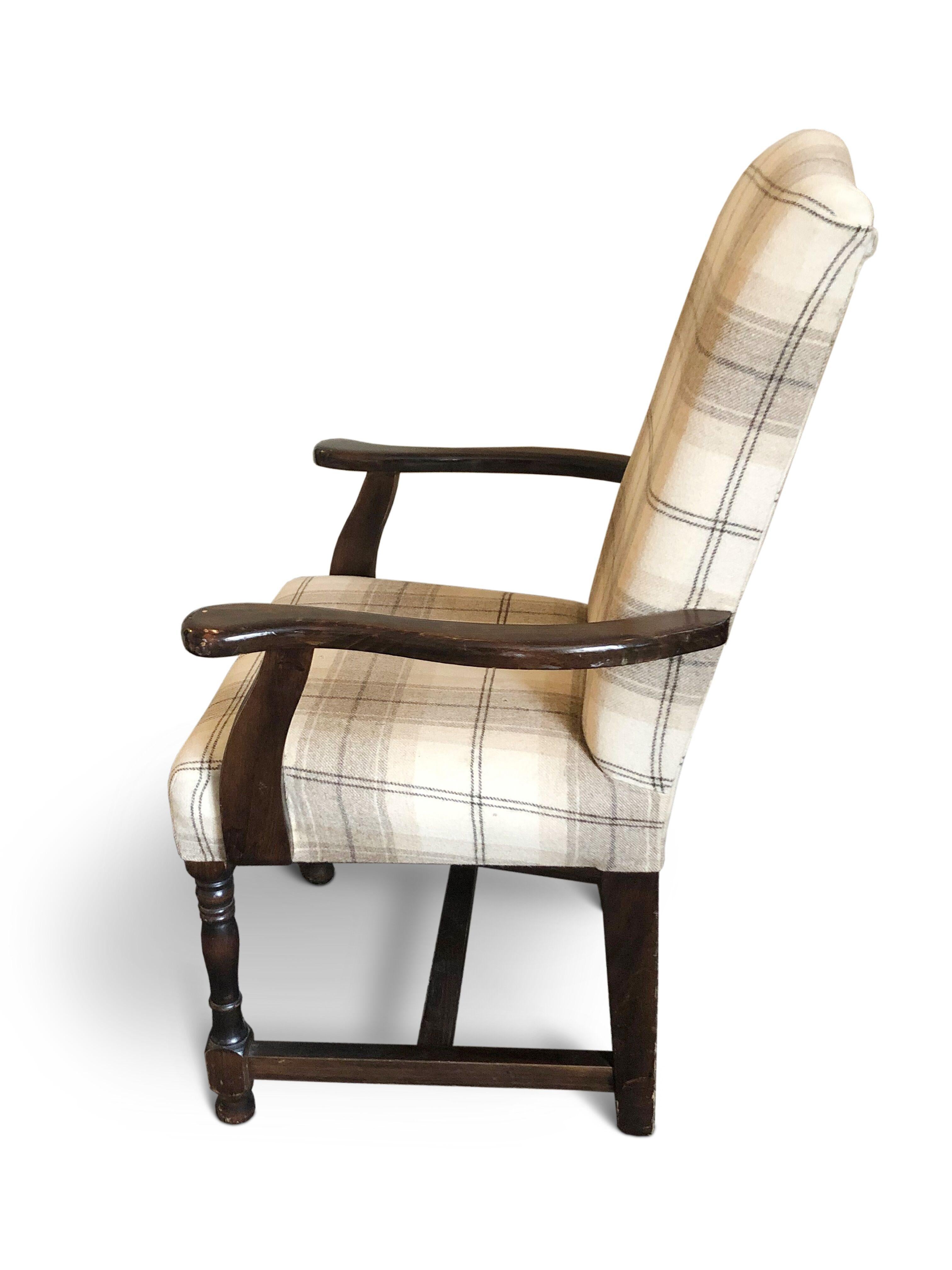 A long set of 20 upholstered camel back dining chairs (12 singles and 8 carvers)
Upholstered in a light tartan design fabric over dark oak frames with stretchers.