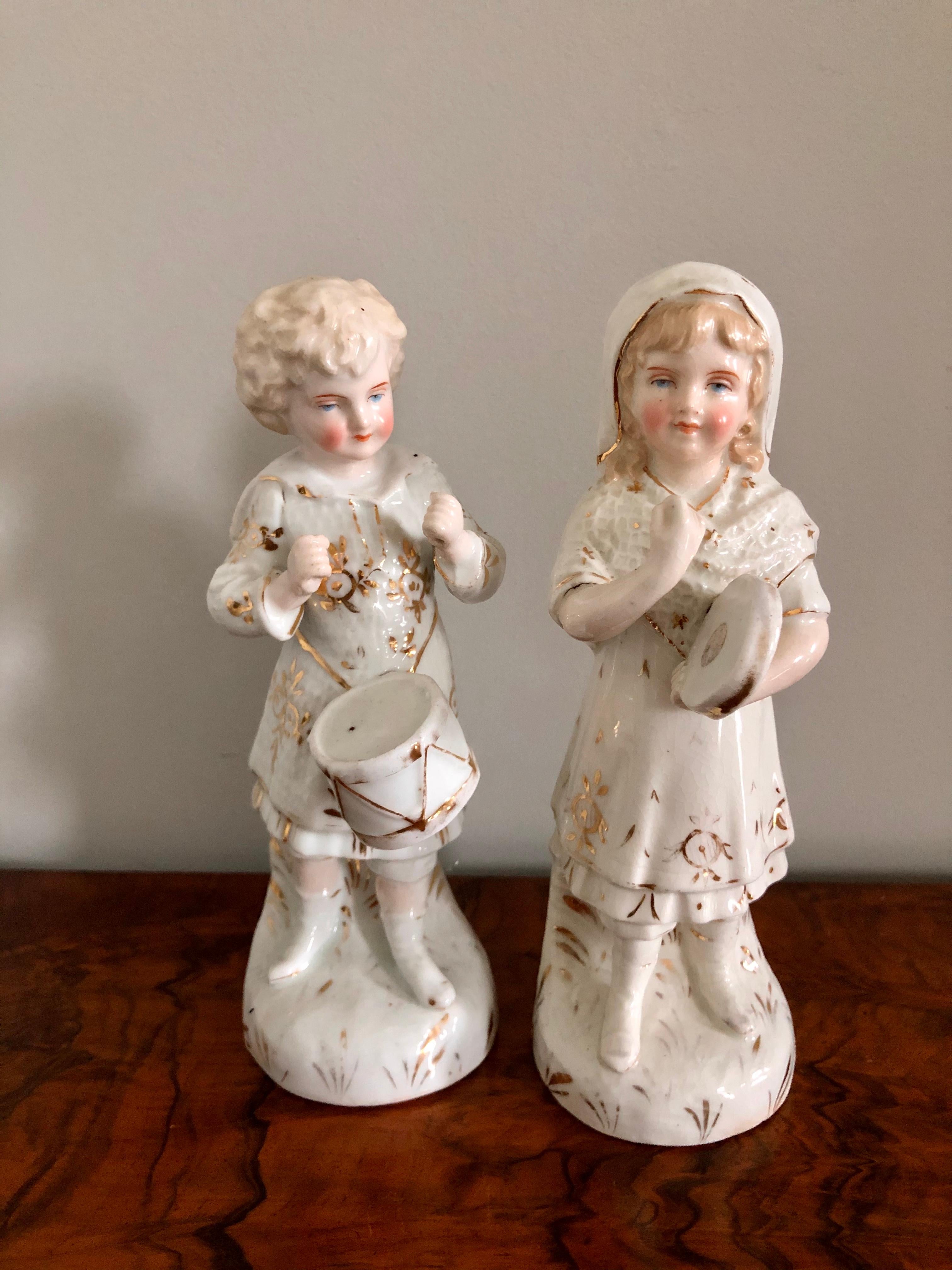 Set of 24 antique continental porcelain figurines in period costumes with delightful hand painted gold colour decoration, some with musical instruments and all standing on a shaped base. Made in Germany.

A very charming collection all in lovely