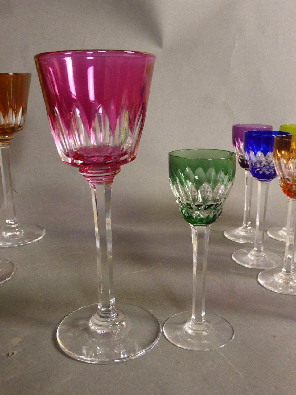 Set of 24 graven and colored crystal glasses from the famous French house Baccarat.
12 Wine glasses and 12 liqueur glasses. Each glass bears the stamp 