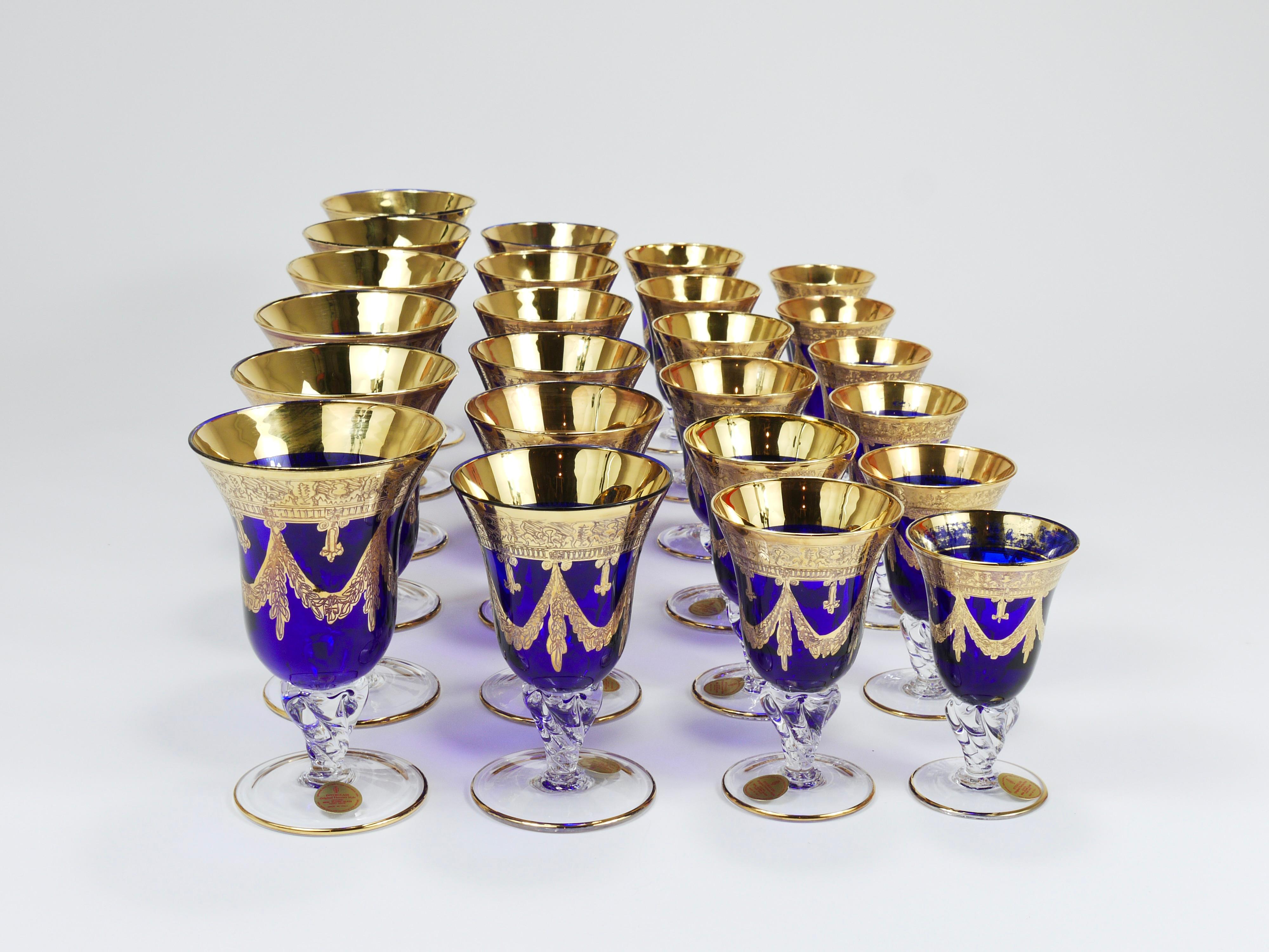 A comprehensive collection of 24 luxurious vintage neoclassical Florence Empire-style royal blue goblets and drinking glasses dated around the 1970s by Interclass, Italy. The set consists of six glasses in four different sizes (please refer to the