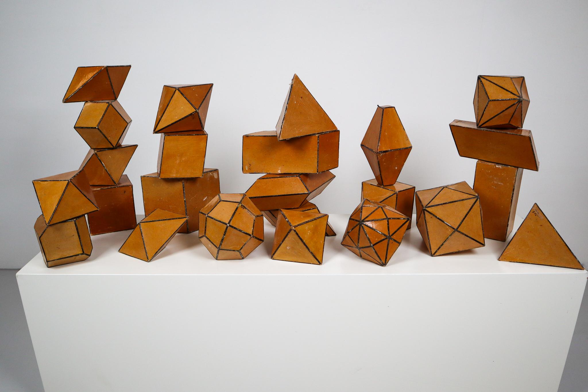 Set of 24 early 20th century cardboard crystal models with black edges. These crystal models used to be used as teaching material at school, to show students the difference in crystal shapes.
Crystals are commonly recognized by their shape,