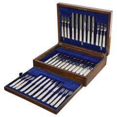 Set of 24 pairs of mother-of-pearl & silver fruit eaters