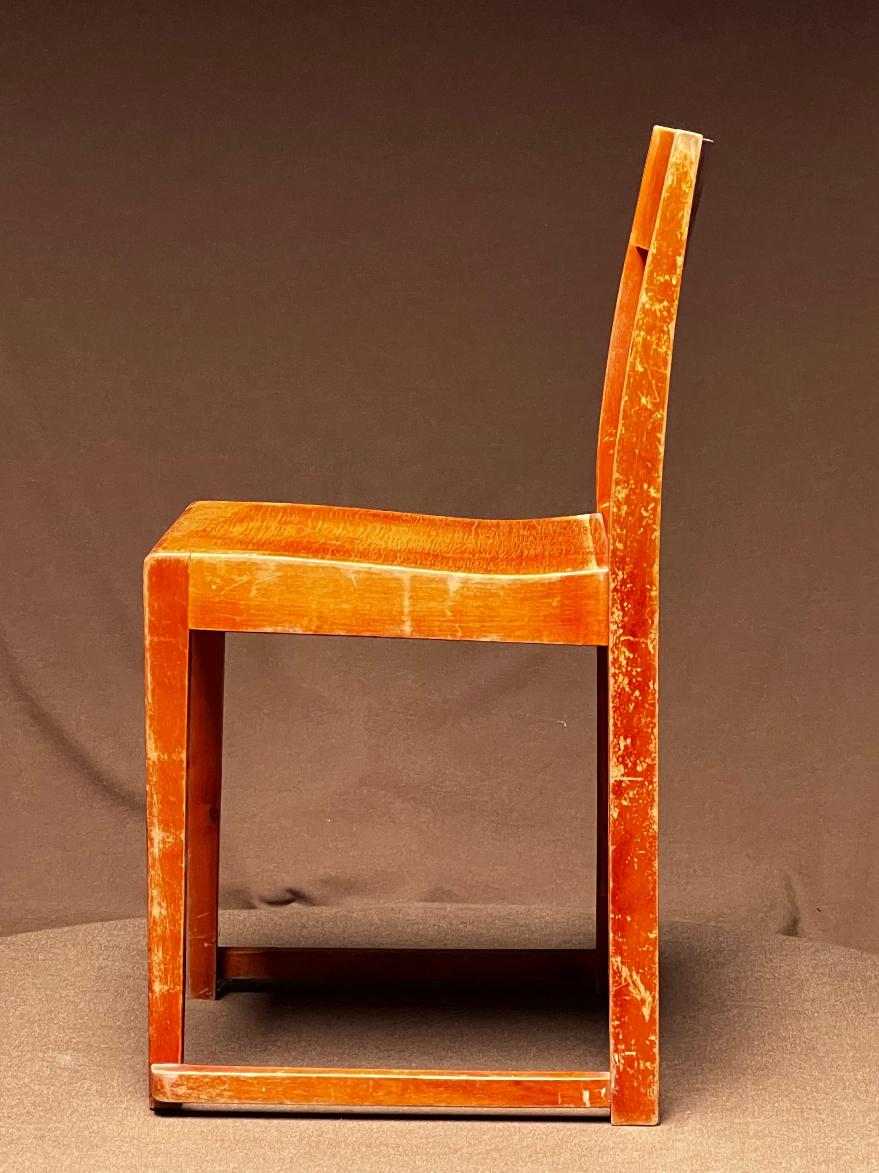 Set of 24 minimal and elegant lightweight confortable stacking chairs by modernist architect Sven Markelius. Designed and produced for the orchestra of the Helsingborg theater in Sweden in 1931. These are honey orangish stained birch that is very