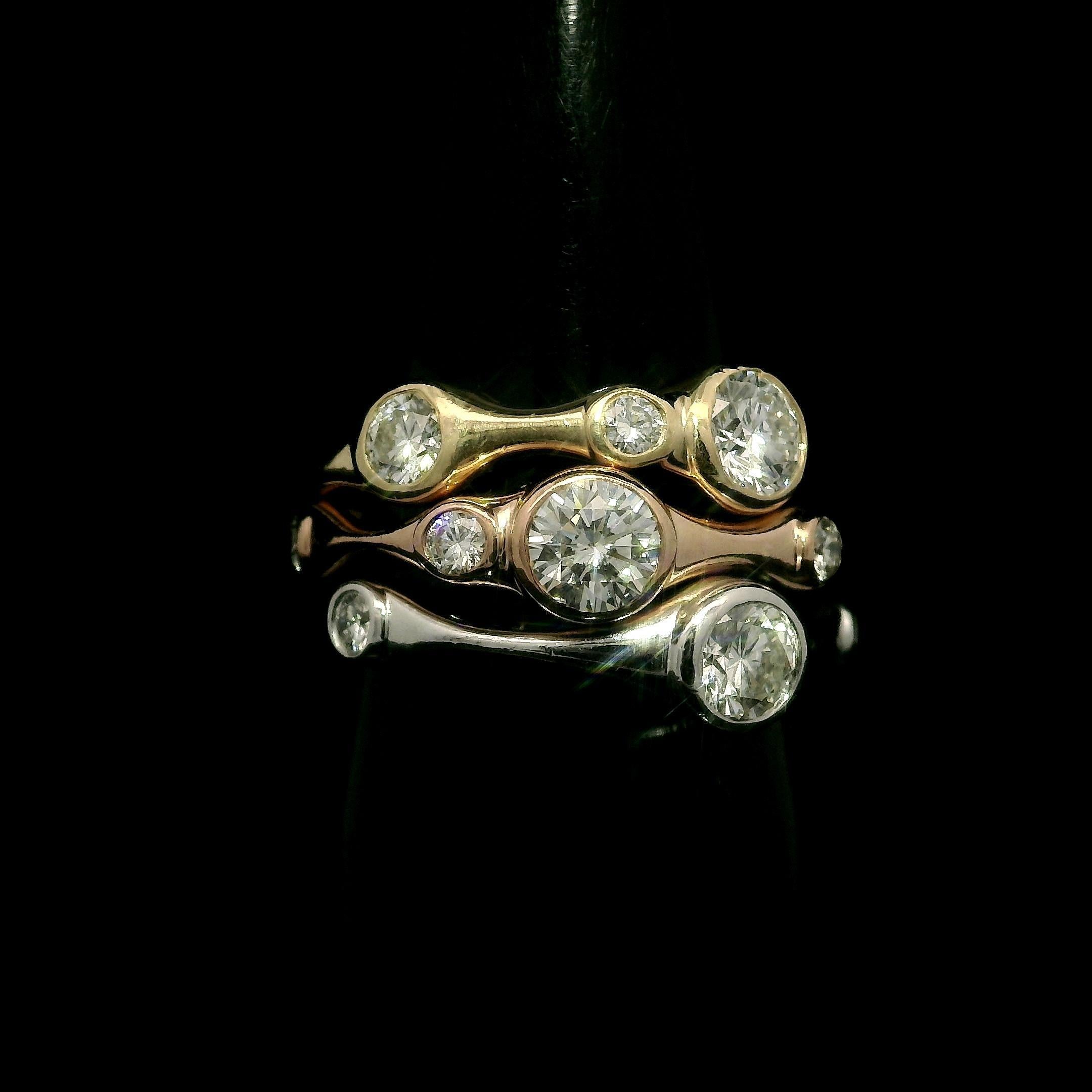 --Stone(s):--
(3) Natural Genuine Diamonds - Round Brilliant Cut - Bezel Set - G/H Color - SI1 Clarity - 0.80ctw (approx.)
(7) Natural Genuine Diamonds - Round Brilliant Cut - Bezel Set - Nice Brilliant White Color - SI1-I1 Clarity - 0.28ctw