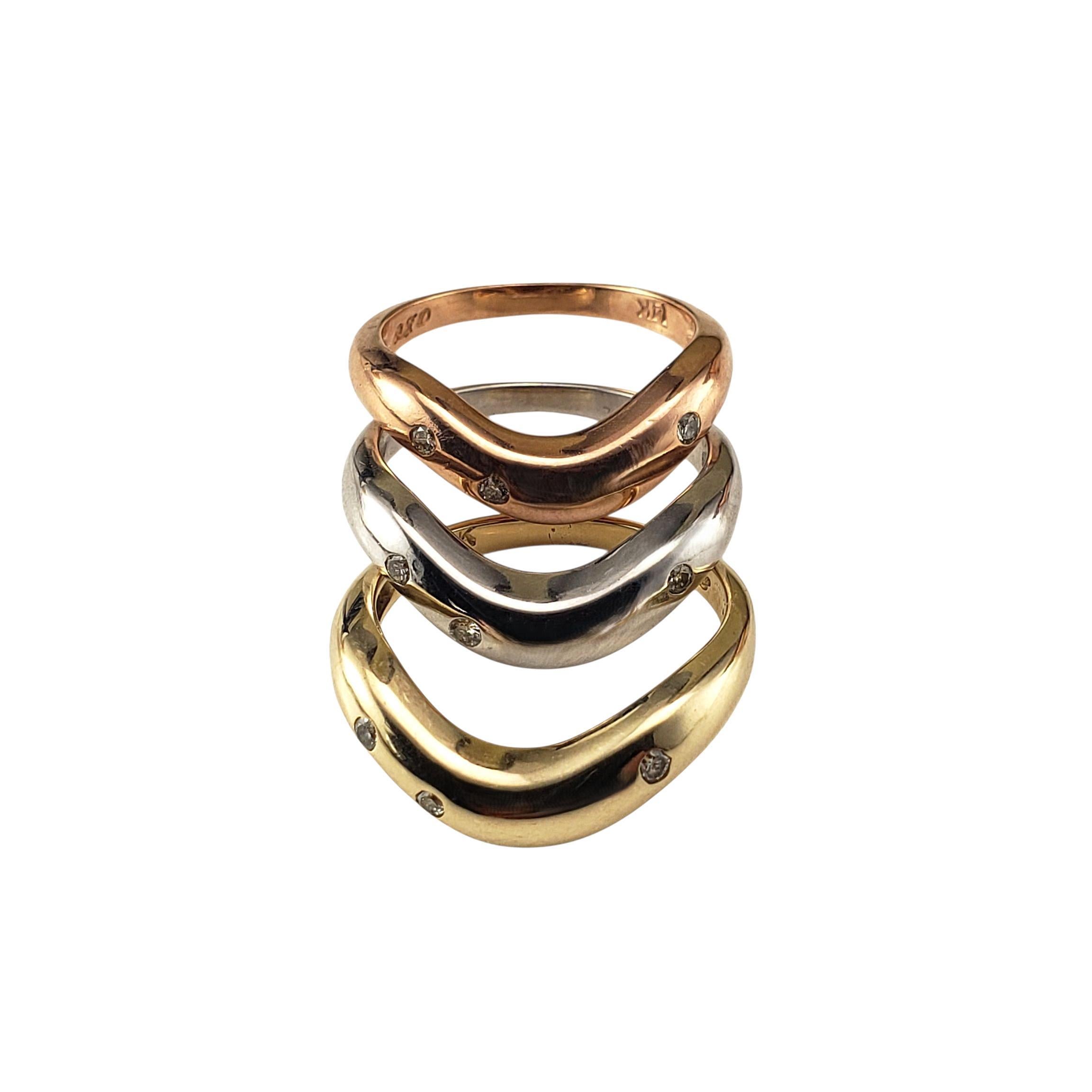 Set of 3 Tricolor and Diamond Stacking Rings Size 6.25-

These sleek stacking rings are crafted in 14K rose, yellow and rose gold and each feature three round sparkling diamonds, bezel set for a refined touch. Wear them stacked together for a bold,