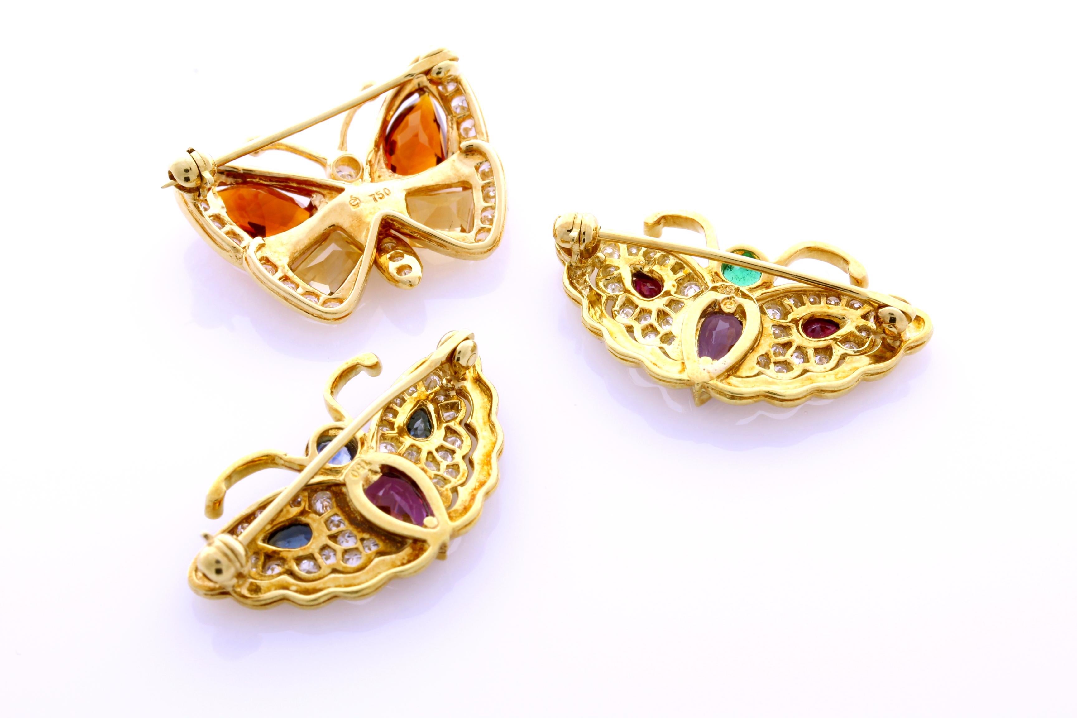 Incredible deal on set of 3, 18 Karat Yellow Gold, Genuine Colored Stone and Diamond Brooches.
This contemporary mounting is formed from 18 Karat Yellow Gold. 
This Genuine Colored Stones on this set are Garnet, Citrine, Amethyst, Sapphire, Ruby,