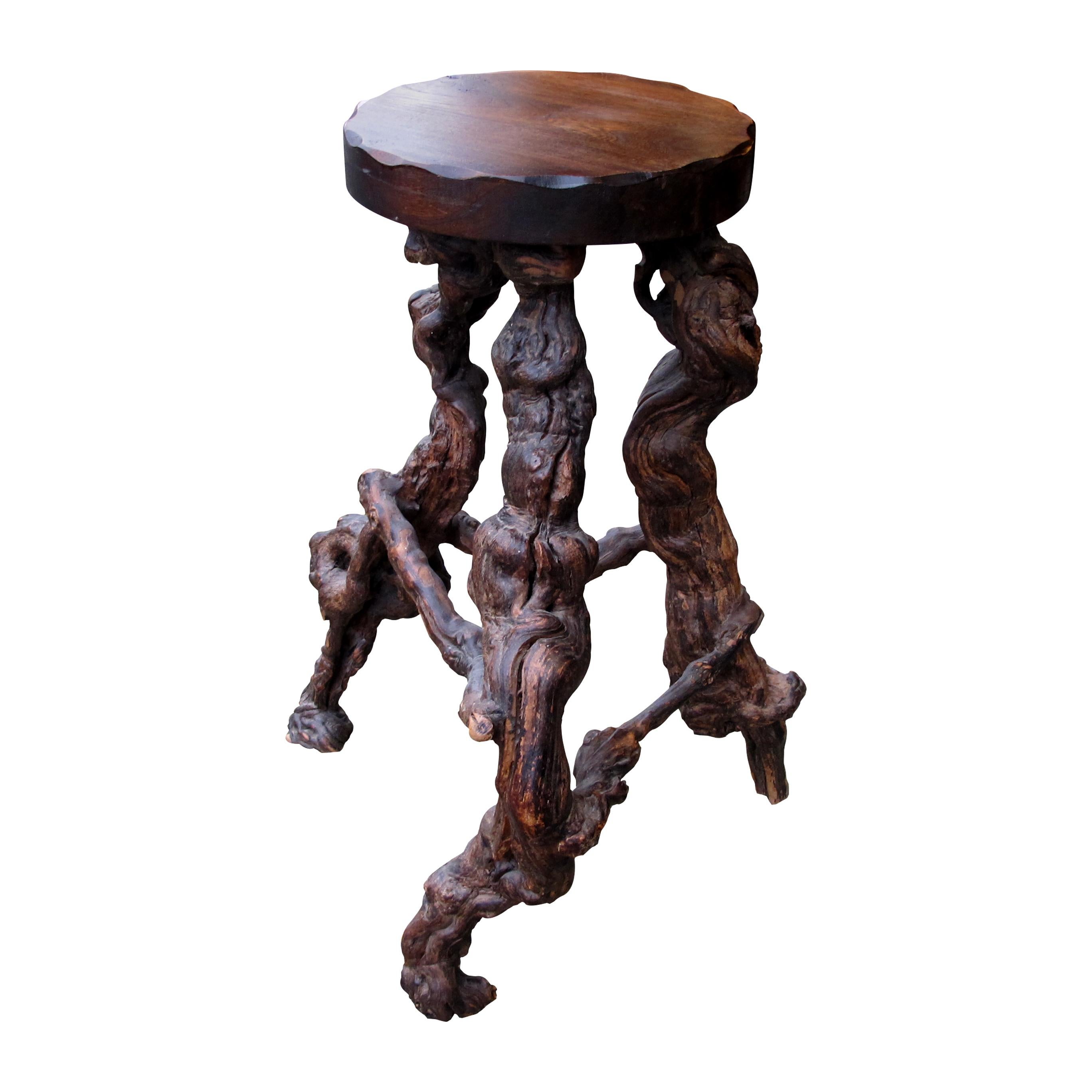 An unusual set of 3 French 1950s mid-century grapevine bar stools. These unique and bespoke stools have been handcrafted individually; the base is made of naturally twisted vine roots; therefore, making each stool unique. The stools have acquired a