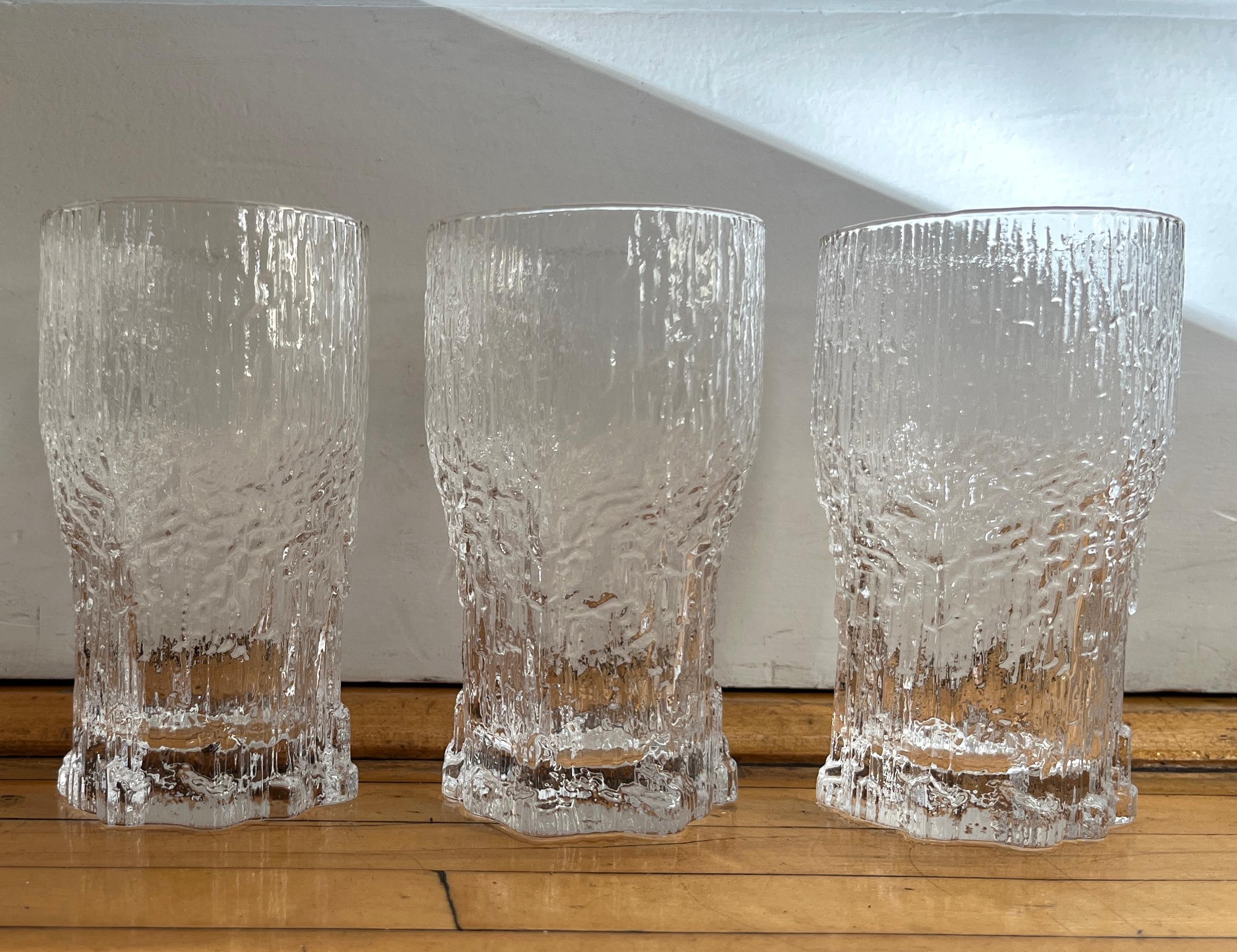 Set of 3 Icicle Art Aslak Highball or Beer Glasses designed by Tapio Wirkkala for renowned Finnish glass company Iittala. Gorgeous design conjuring icy beauty.

The glasses are in perfect condition. Solid and sparkly. 

NOTE: The video includes a