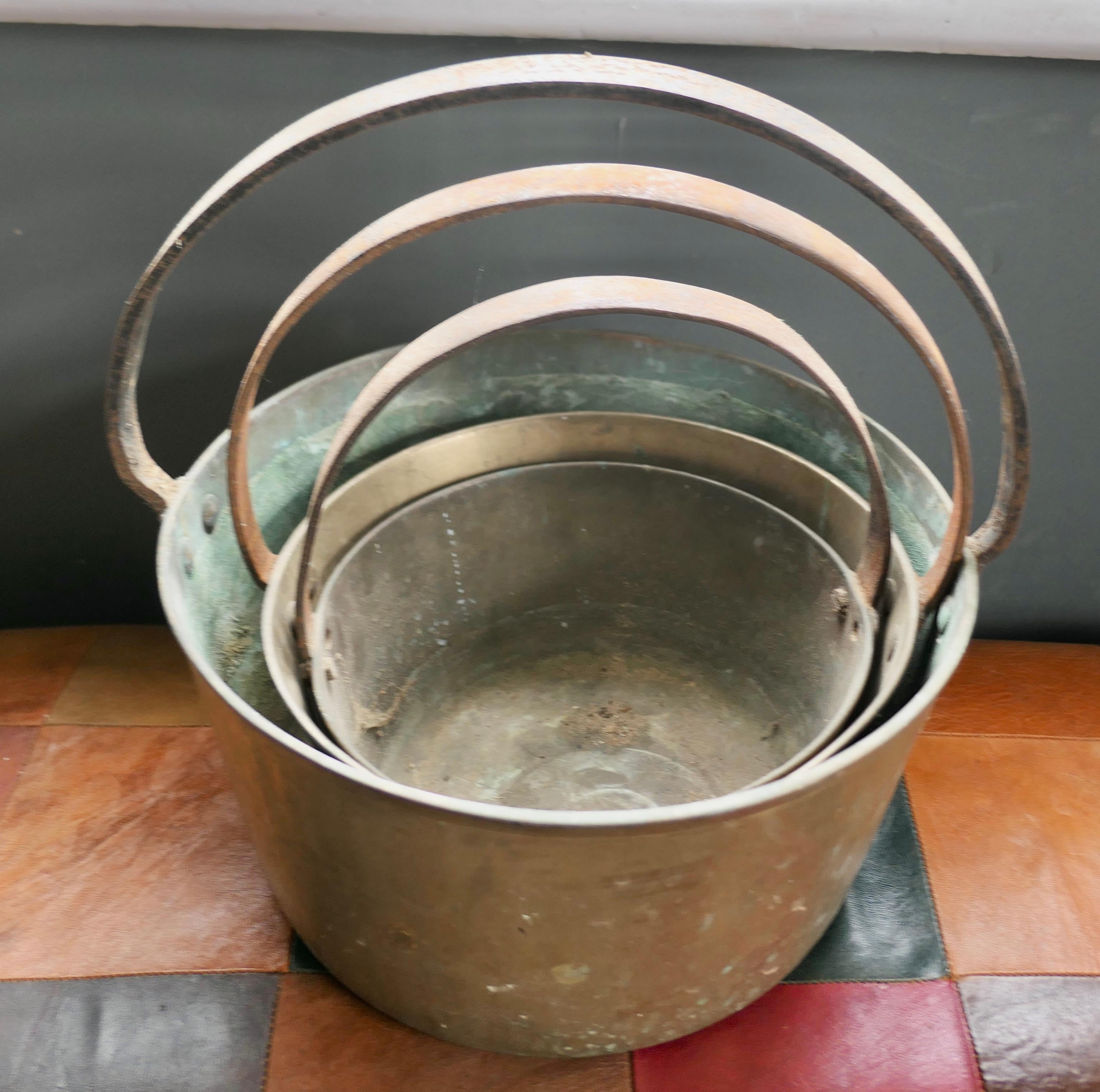 Set of 3 19th century brass preserving pans or cooking pots.

A superb piece of social history and a must for the kitchenalia, collector, this is a 19th century set, they are very heavy and well used 
The Pots are in good sound if used condition,