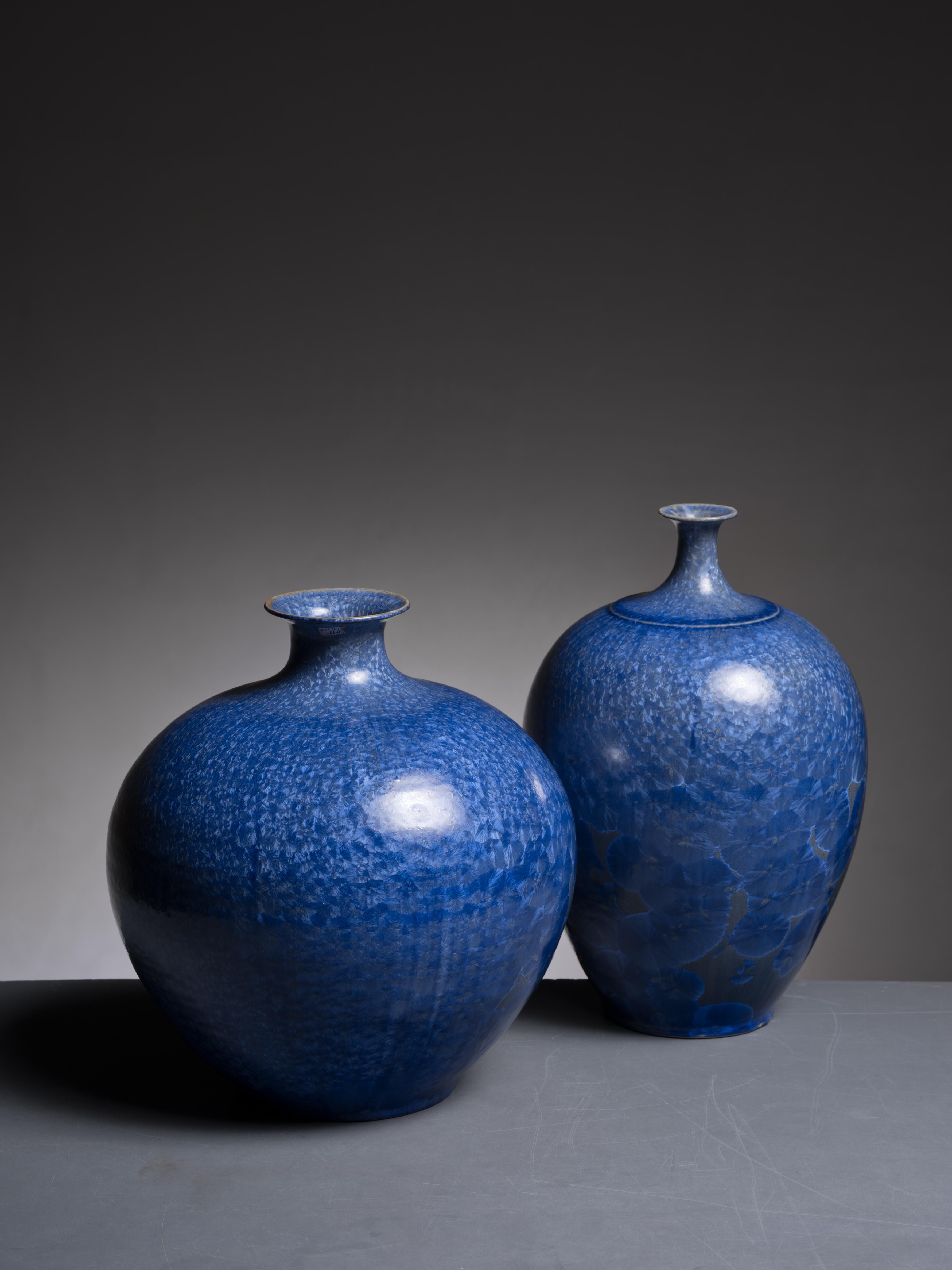 A set of three of hand-thrown ceramic vases with a blue crystalline glazing by Albert Kiessling for his Töpferei Kiessling in Langhessen, Germany. Marked by Kiessling and in an excellent condition.

The measurements stated are of the largest vase.