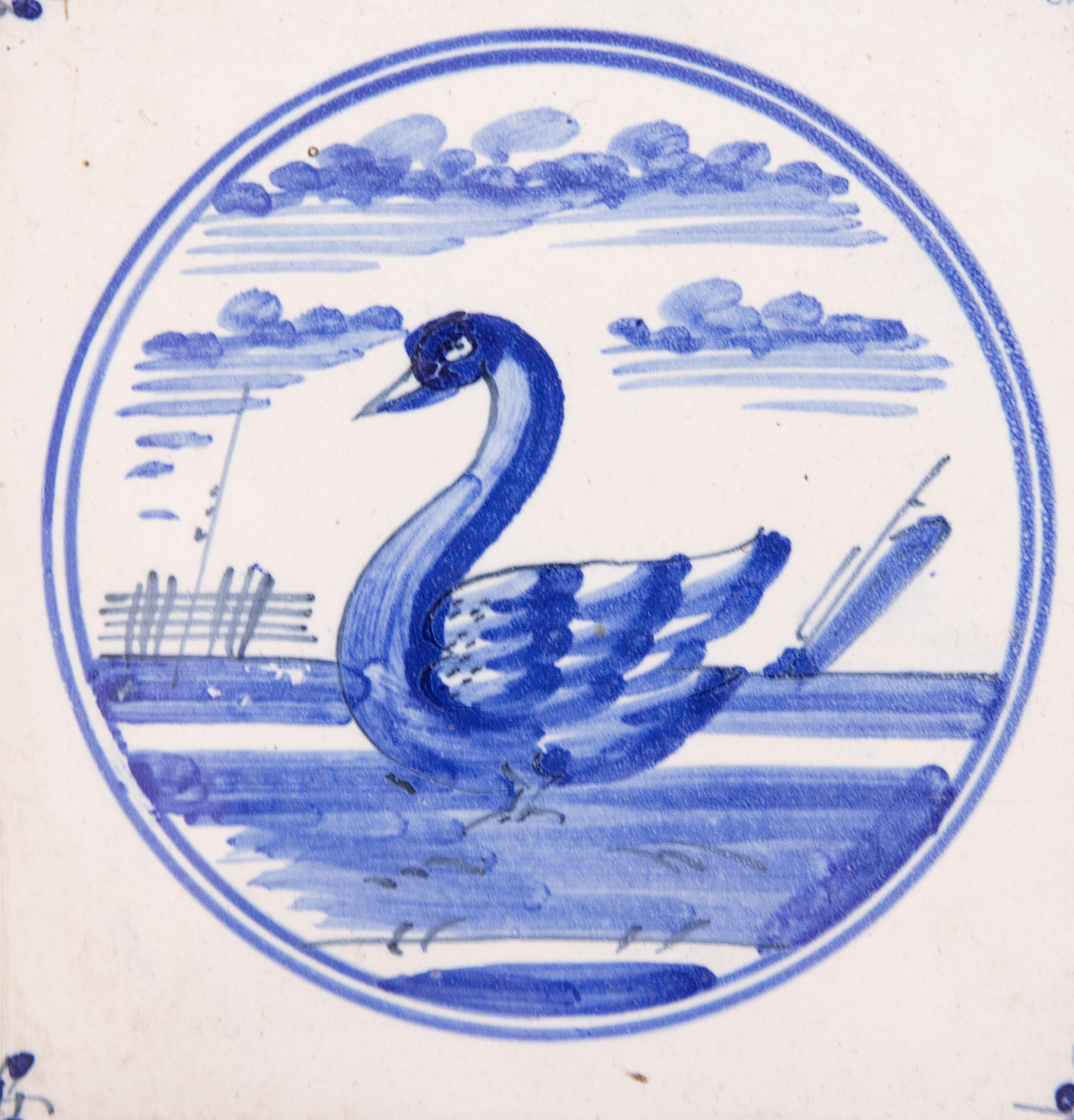 A charming set of three 18th-Century Dutch Delft faience hand molded tiles depicting swans and a Dutch country home hand painted in cobalt blue and white. The tiles are in a custom mahogany frame and are ready to hang.

DIMENSIONS
17.25ʺW × 1.2ʺD ×