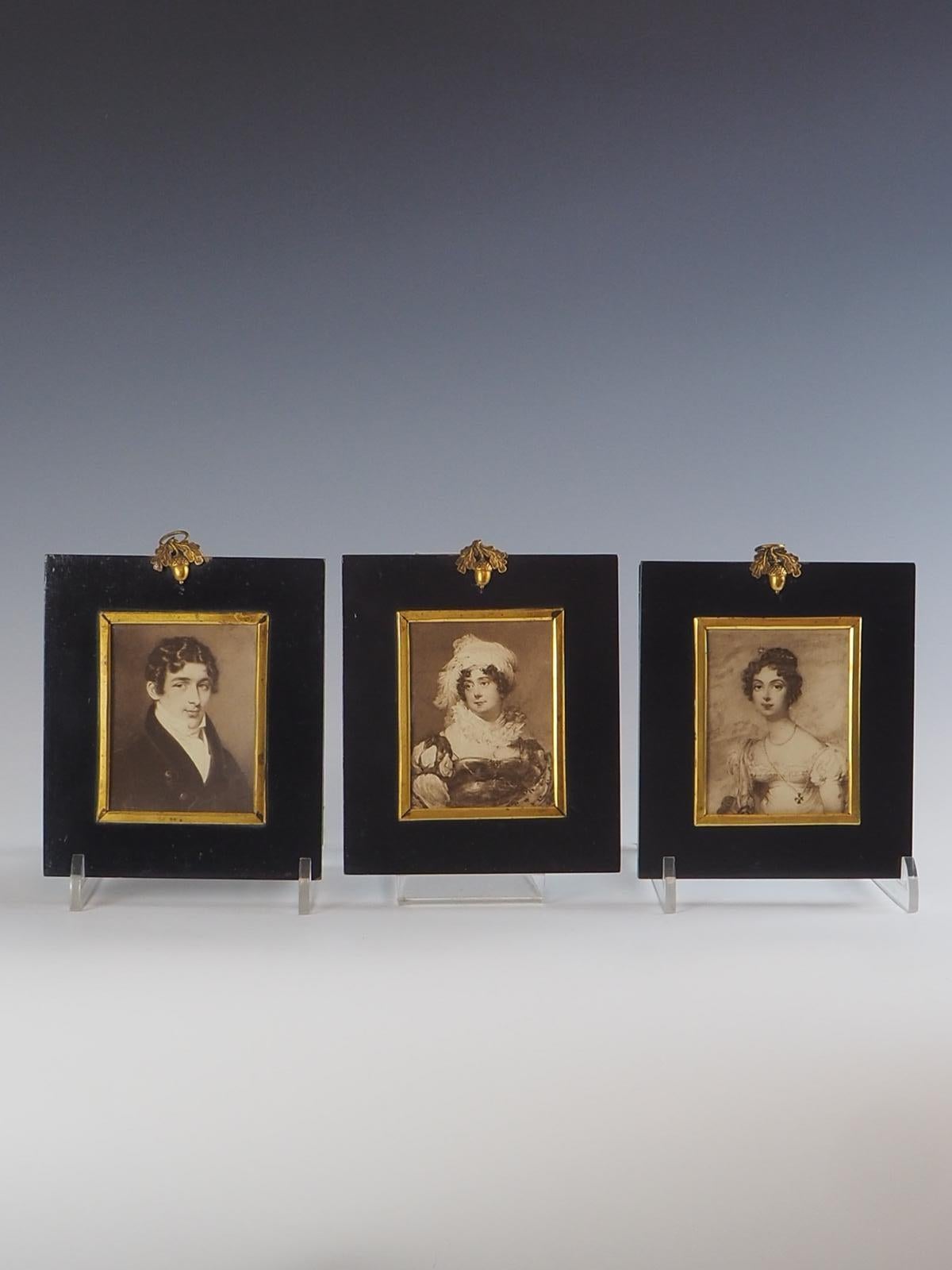 Set of 3 Antique Acorn Miniatures with Original Photographs is truly a remarkable piece of history. The beautifully crafted black miniature ebony frames, adorned with gilded acorns, add a touch of elegance to any space.

What sets these miniatures