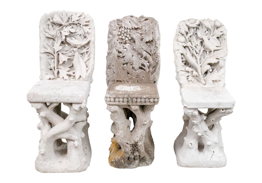 Likely English, comparable to antique English carved architectural foliate elements. All carved faux bois chairs with branch form frames and carved high relief backs with foliage and birds. In the manner of William Morris Arts & Crafts floral