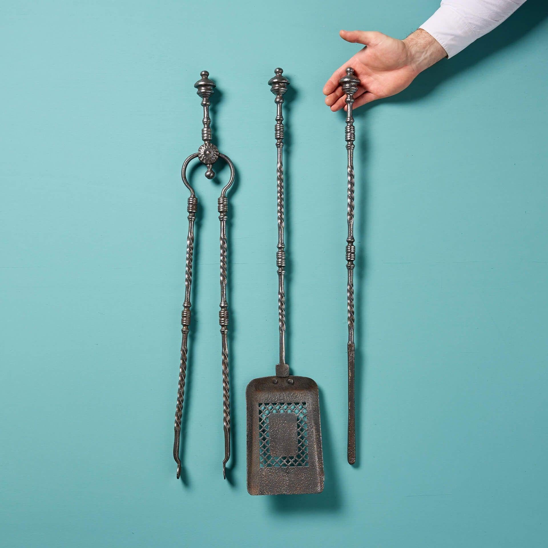 A set of three original antique Georgian era fire irons. This fire tool set includes a poker, tongs and a pierced shovel with matching twist decoration to the handles. The perfect finishing touch to any fireplace!

Additional Information

Dimensions